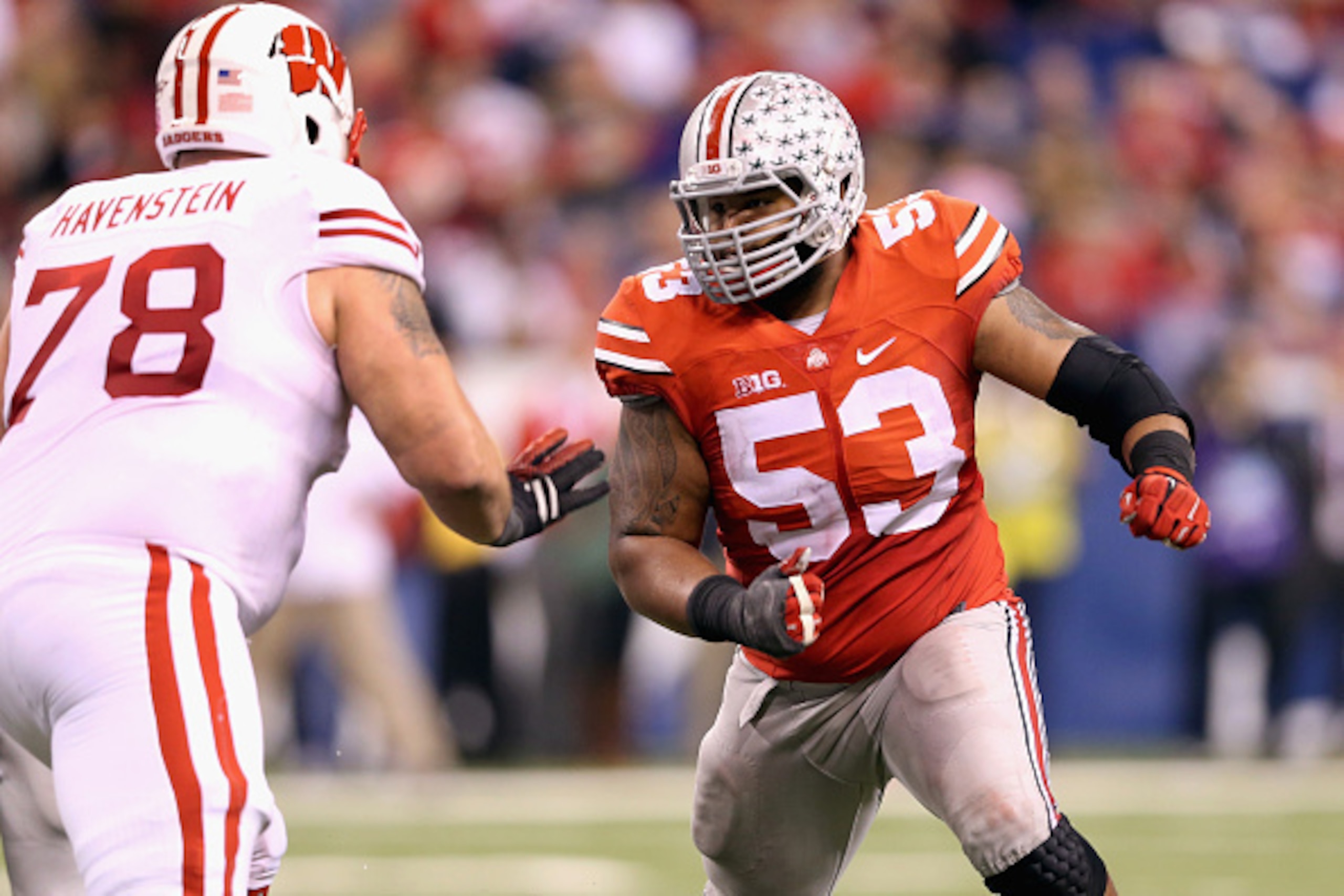 INDIANAPOLIS, IN - DECEMBER 06: Defensive lineman Michael Bennett wears #53 to honor late teammate Kosta Karageorge of the Ohio State Buckeyes while playing in the Big Ten Championship against the Wisconsin Badgers at Lucas Oil Stadium on December 6, 201 INDIANAPOLIS, IN - DECEMBER 06: Defensive lineman Michael Bennett wears #53 to honor late teammate Kosta Karageorge of the Ohio State Buckeyes while playing in the Big Ten Championship against the Wisconsin Badgers at Lucas Oil Stadium on December 6, 201