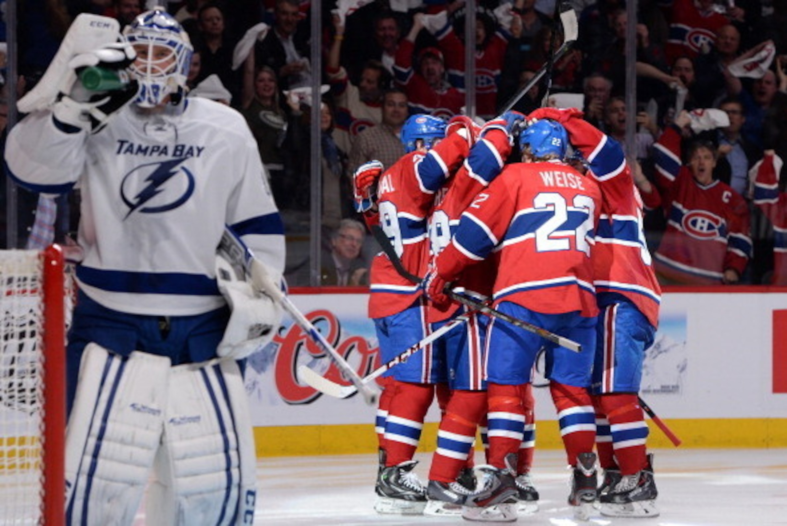 MONTREAL, QC - APRIL 22: Daniel Briere #48 of the Montreal Canadiens celebrates with teammates Dale Weise #22, Michael Bournival #49 and Francis Bouillon #55 after scoring a goal on Anders Lindback #39 of the Tampa Bay Lightning in Game Four of the First 