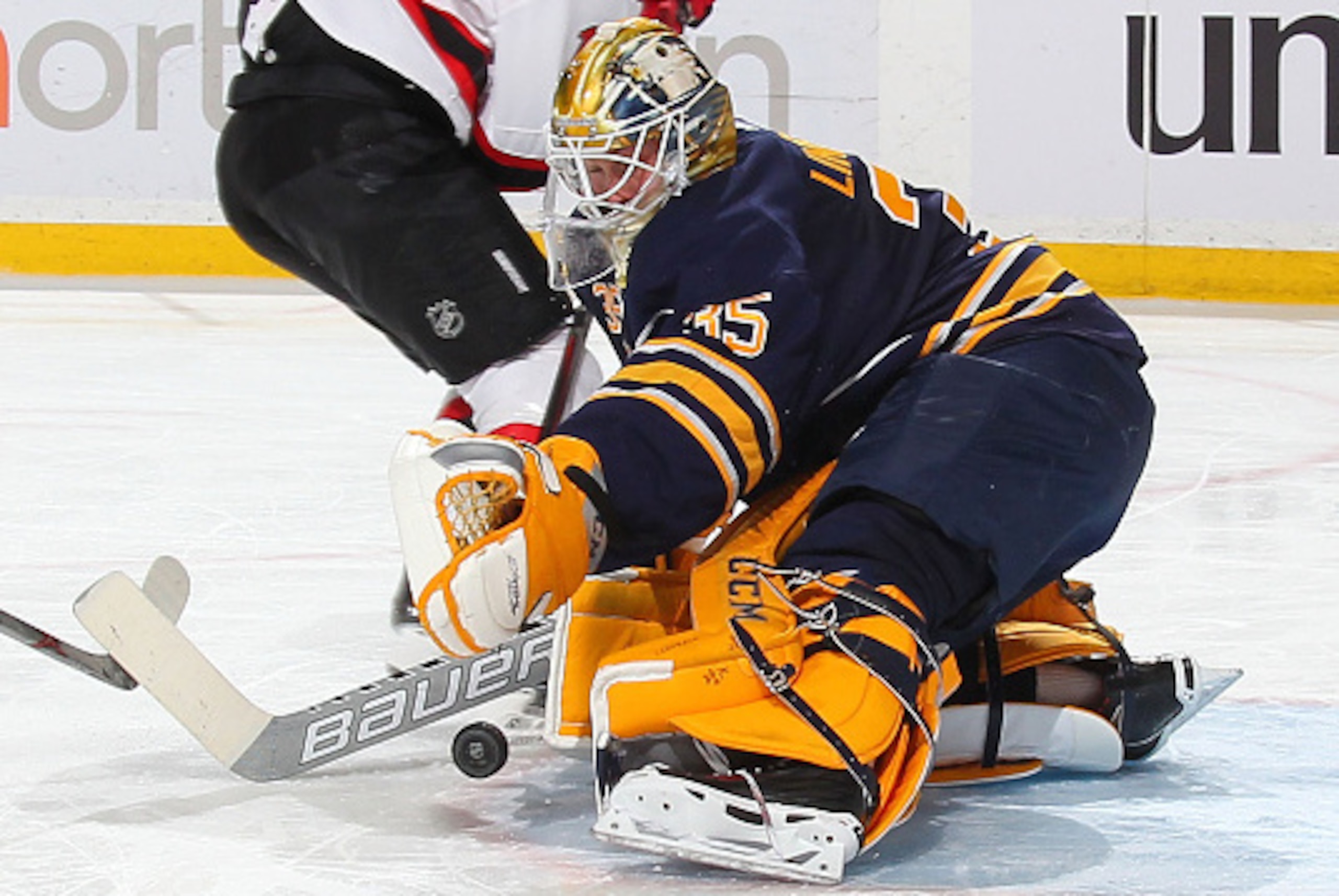 BUFFALO, NY - MARCH 20:  Anders Lindback #35 of the Buffalo Sabres makes a second period save on Michael Ryder #17 of the New Jersey Devils on March 20, 2015 at the First Niagara Center in Buffalo, New York.  (Photo by Bill Wippert/NHLI via Getty Images)