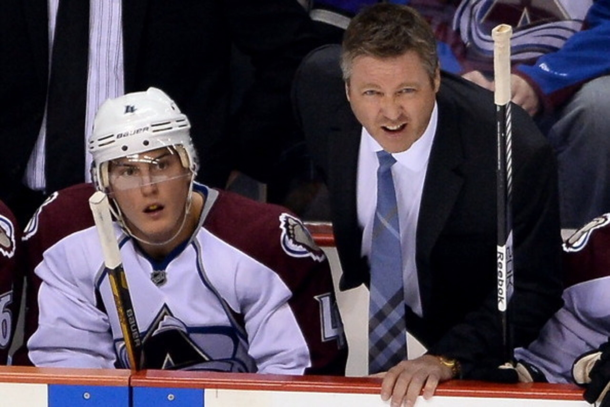 LAS VEGAS, NV - SEPTEMBER 28:  Tyson Barrie #4 of the Colorado Avalanche and head coach Patrick Roy appear on the bench during their preseason game against the Los Angeles Kings at the MGM Grand Garden Arena on September 28, 2013 in Las Vegas, Nevada. Col