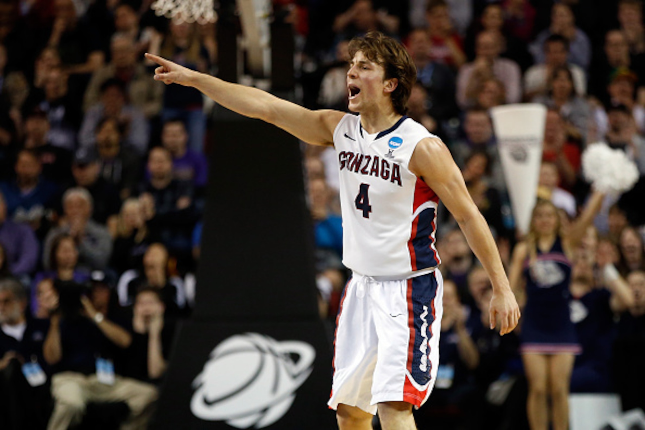 SEATTLE, WA - MARCH 22:  Kevin Pangos #4 of the Gonzaga Bulldogs points on court in the first half of the game against the Iowa Hawkeyes during the third round of the 2015 NCAA Men's Basketball Tournament at KeyArena on March 22, 2015 in Seattle, Washingt
