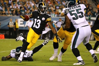 PHILADELPHIA, PA - AUGUST 21: Wide receiver Dri Archer #13 of the Pittsburgh Steelers avoids the tackle of linebacker Emmanuel Acho #51 of the Philadelphia Eagles on August 21, 2014 at Lincoln Financial Field in Philadelphia, Pennsylvania. (Photo by Al Be