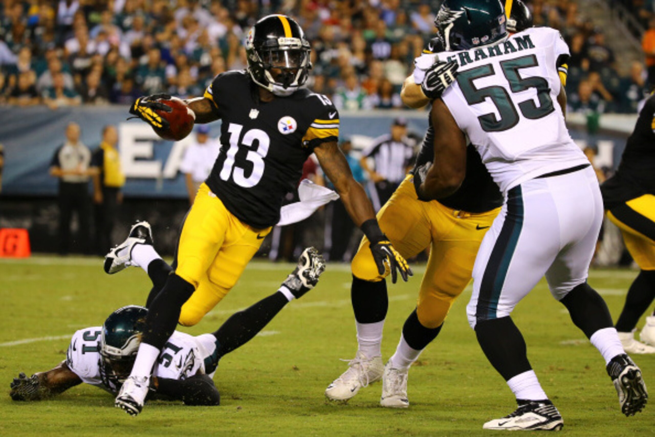 PHILADELPHIA, PA - AUGUST 21: Wide receiver Dri Archer #13 of the Pittsburgh Steelers avoids the tackle of linebacker Emmanuel Acho #51 of the Philadelphia Eagles on August 21, 2014 at Lincoln Financial Field in Philadelphia, Pennsylvania. (Photo by Al Be PHILADELPHIA, PA - AUGUST 21: Wide receiver Dri Archer #13 of the Pittsburgh Steelers avoids the tackle of linebacker Emmanuel Acho #51 of the Philadelphia Eagles on August 21, 2014 at Lincoln Financial Field in Philadelphia, Pennsylvania. (Photo by Al Be