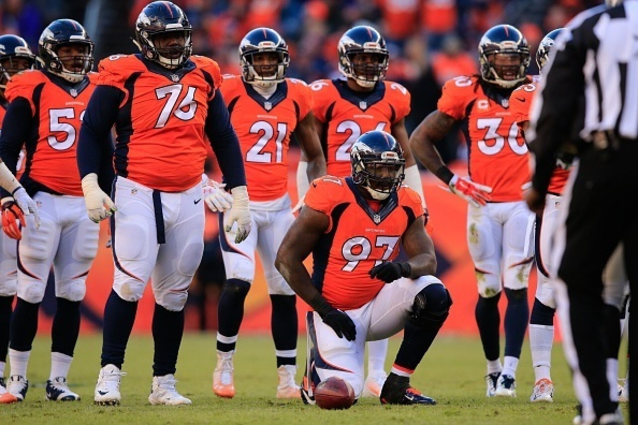 DENVER, CO - DECEMBER 28:  Defensive end Malik Jackson #97 of the Denver Broncos kneels in front of the Denver Broncos defensive line during a game against the Oakland Raiders at Sports Authority Field at Mile High on December 28, 2014 in Denver, Colorado