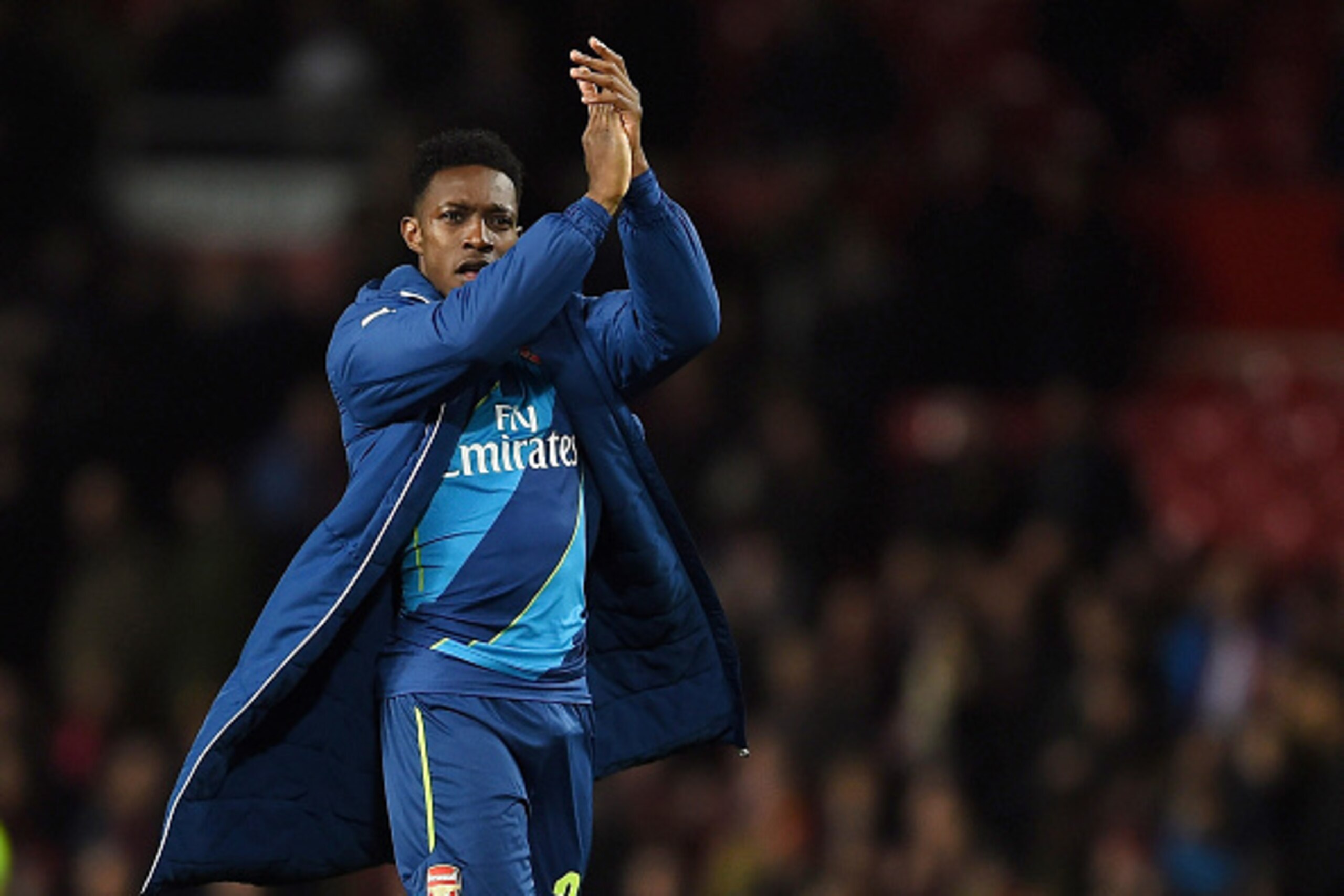 MANCHESTER, ENGLAND - MARCH 09:  Matchwinning goal scorer Danny Welbeck of Arsenal applauds the travelling fans following their team's 2-1 victory during the FA Cup Quarter Final match between Manchester United and Arsenal at Old Trafford on March 9, 2015