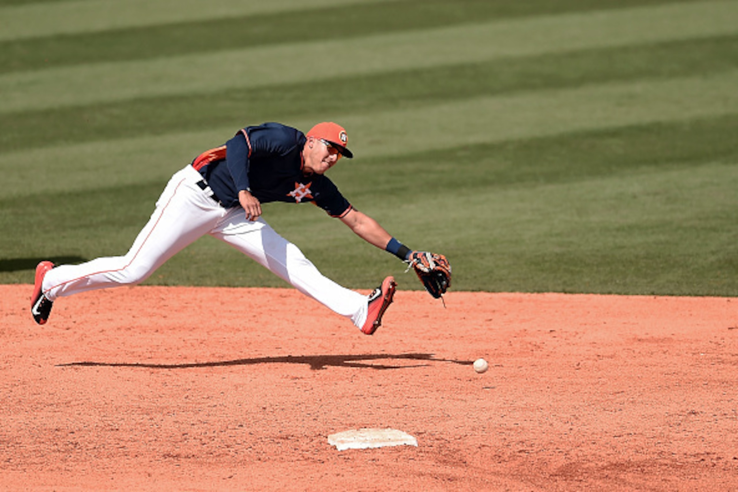KISSIMMEE, FL - MARCH 10:  Carlos Correa #76 of the Houston Astros tries to fields a ground ball during the sixth inning of a spring training game against the St. Louis Cardinals at Osceola County Stadium on March 10, 2015 in Kissimmee, Florida.  (Photo b