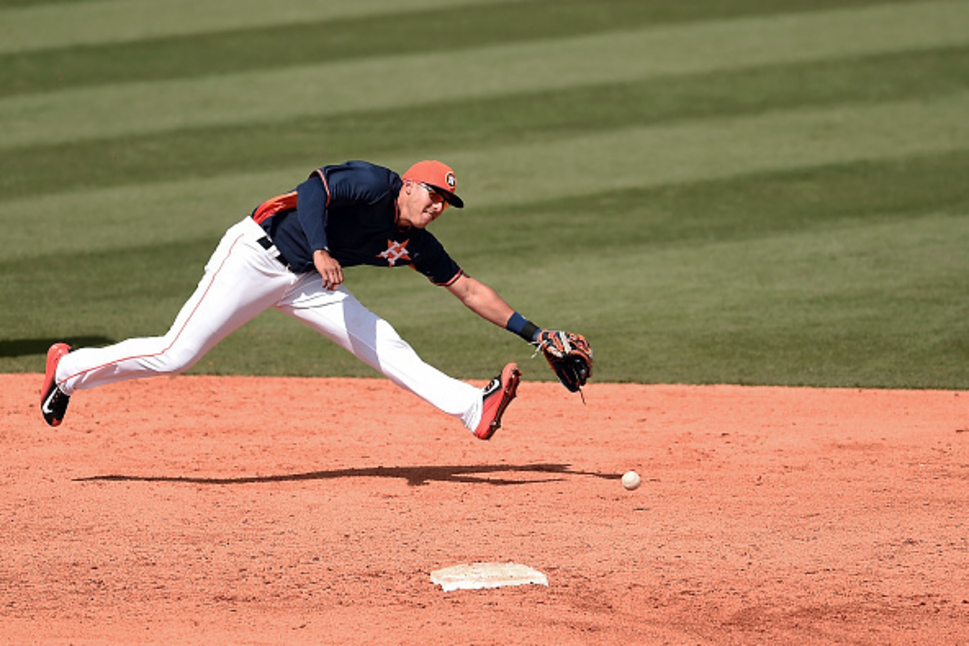 KISSIMMEE, FL - MARCH 10:  Carlos Correa #76 of the Houston Astros tries to fields a ground ball during the sixth inning of a spring training game against the St. Louis Cardinals at Osceola County Stadium on March 10, 2015 in Kissimmee, Florida.  (Photo b