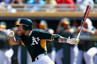 MESA, AZ - MARCH 10:  Brett Lawrie #15 of the Oakland Athletics bats against the Arizona Diamondbacks during the spring training game at HoHoKam Stadium on March 10, 2015 in Mesa, Arizona.  (Photo by Christian Petersen/Getty Images)
