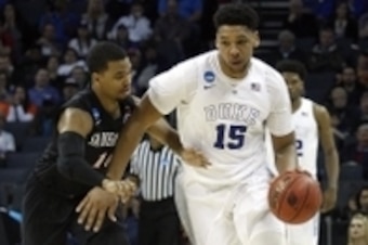 Mar 22, 2015; Charlotte, NC, USA; Duke Blue Devils center Jahlil Okafor (15) brings the ball up courtagainst San Diego State Aztecs guard Aqeel Quinn (10) during the second half in the third round of the 2015 NCAA Tournament at Time Warner Cable Arena. Ma