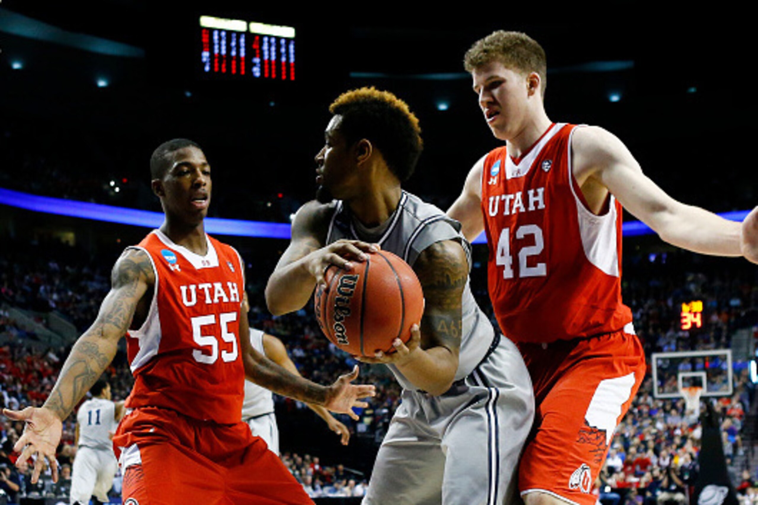 PORTLAND, OR - MARCH 21:  D'Vauntes Smith-Rivera #4 of the Georgetown Hoyas controls the ball against Delon Wright #55 and Jakob Poeltl #42 of the Utah Utes in the first half during the third round of the 2015 NCAA Men's Basketball Tournament at Moda Cent
