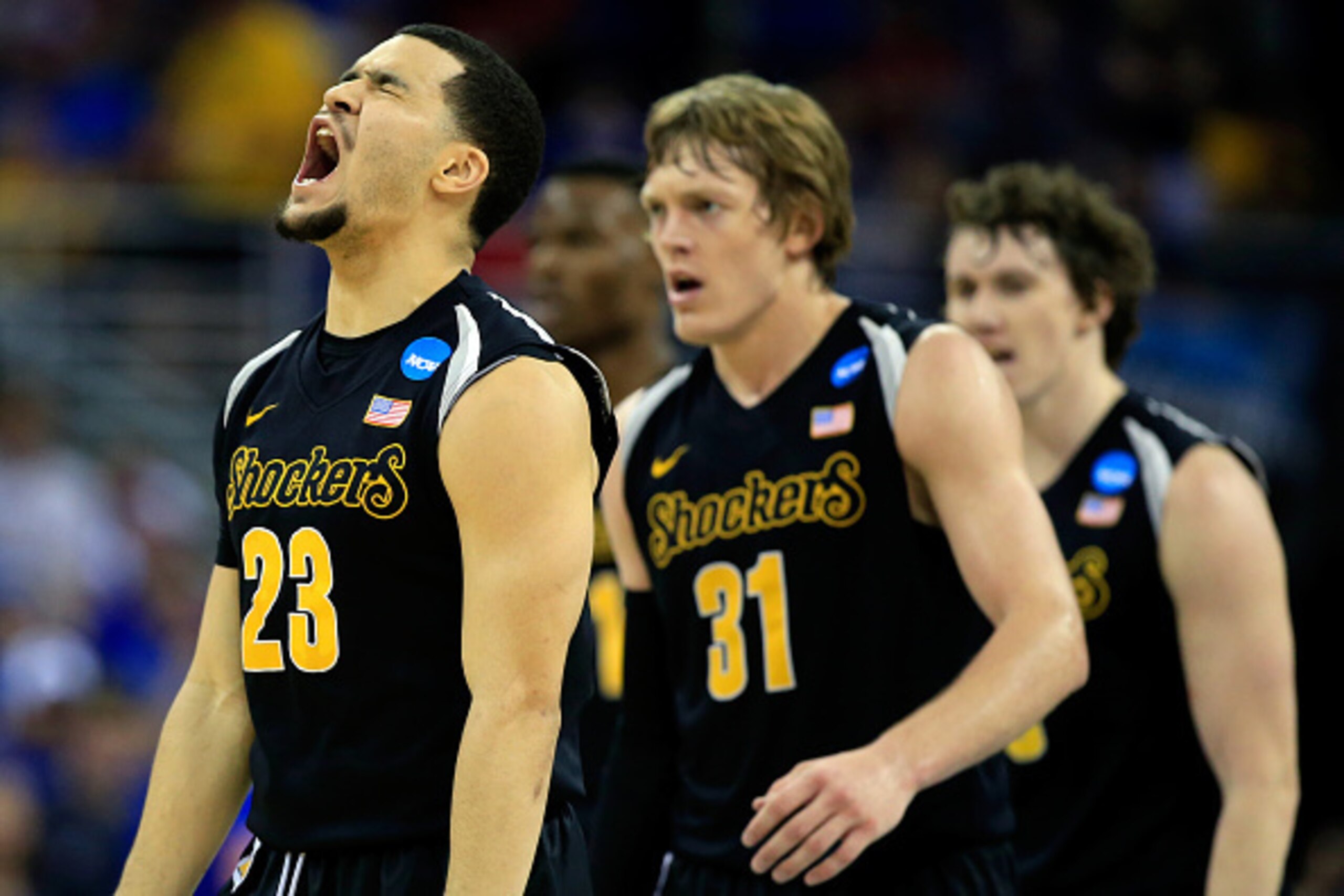 OMAHA, NE - MARCH 22:  Fred VanVleet #23 of the Wichita State Shockers reacts after hitting a three-pointer against the Kansas Jayhawks in the first half during the third round of the 2015 NCAA Men's Basketball Tournament at the CenturyLink Center on Marc