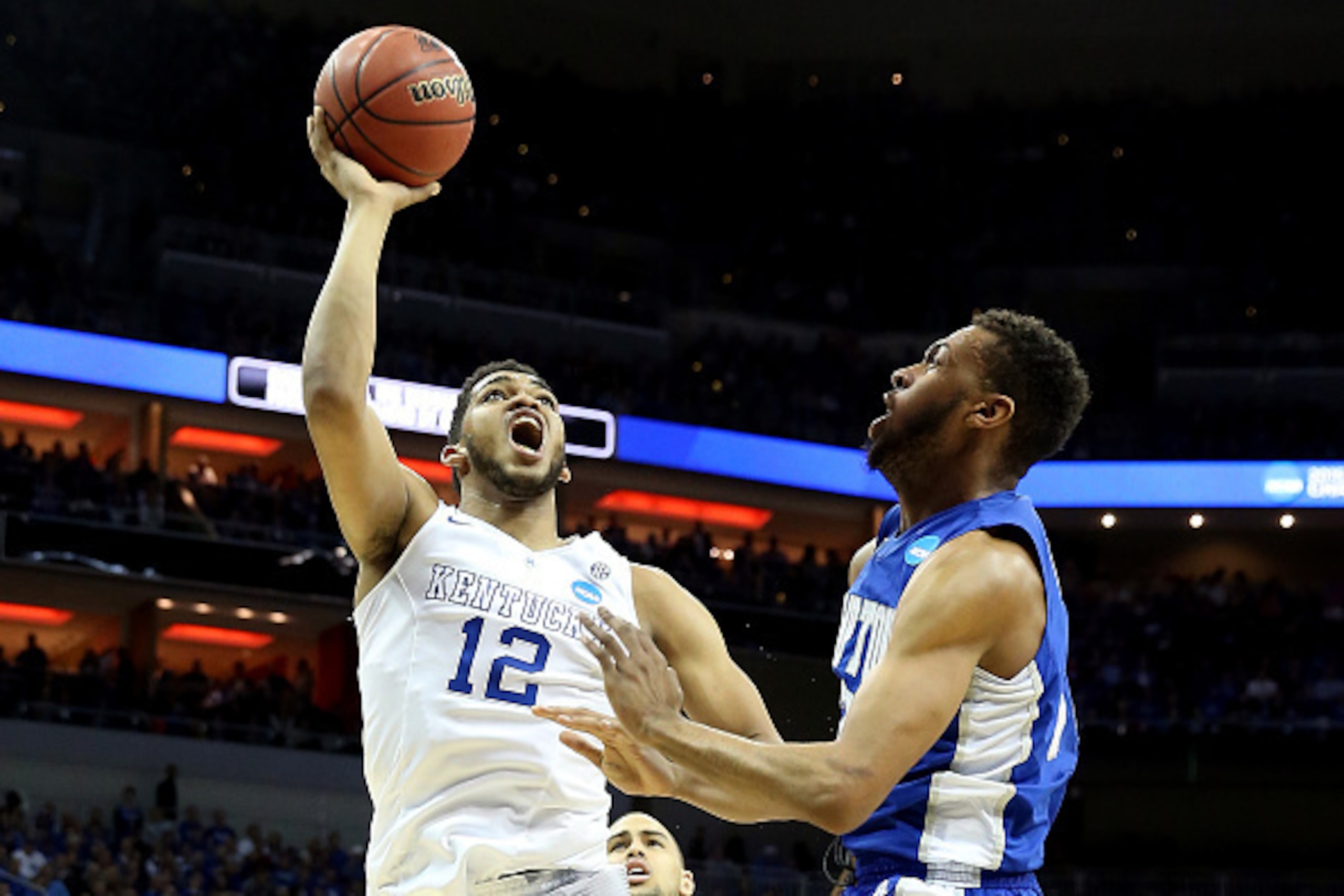 LOUISVILLE, KY - MARCH 19: Karl-Anthony Towns #12 of the Kentucky Wildcats goes up to the basket as Charles Wilson-Fisher #31 of the Hampton Pirates defends during the second round of the 2015 NCAA Men's Basketball Tournament at the KFC YUM! Center on Ma LOUISVILLE, KY - MARCH 19: Karl-Anthony Towns #12 of the Kentucky Wildcats goes up to the basket as Charles Wilson-Fisher #31 of the Hampton Pirates defends during the second round of the 2015 NCAA Men's Basketball Tournament at the KFC YUM! Center on Ma