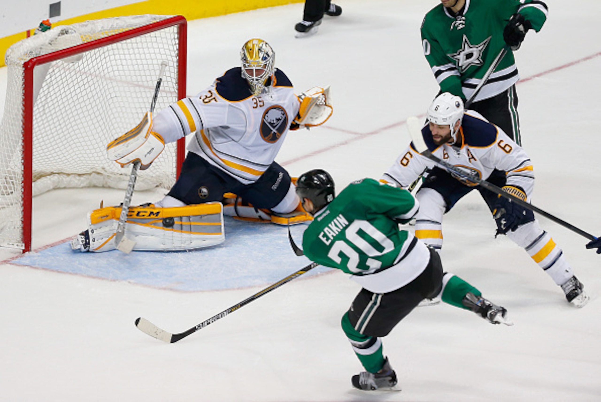 DALLAS, TX - MARCH 23: Cody Eakin #20 of the Dallas Stars scores a goal against Anders Lindback #35 of the Buffalo Sabres as Mike Weber #6 of the Buffalo Sabres defends in the third period at American Airlines Center on March 23, 2015 in Dallas, Texas. DALLAS, TX - MARCH 23: Cody Eakin #20 of the Dallas Stars scores a goal against Anders Lindback #35 of the Buffalo Sabres as Mike Weber #6 of the Buffalo Sabres defends in the third period at American Airlines Center on March 23, 2015 in Dallas, Texas.