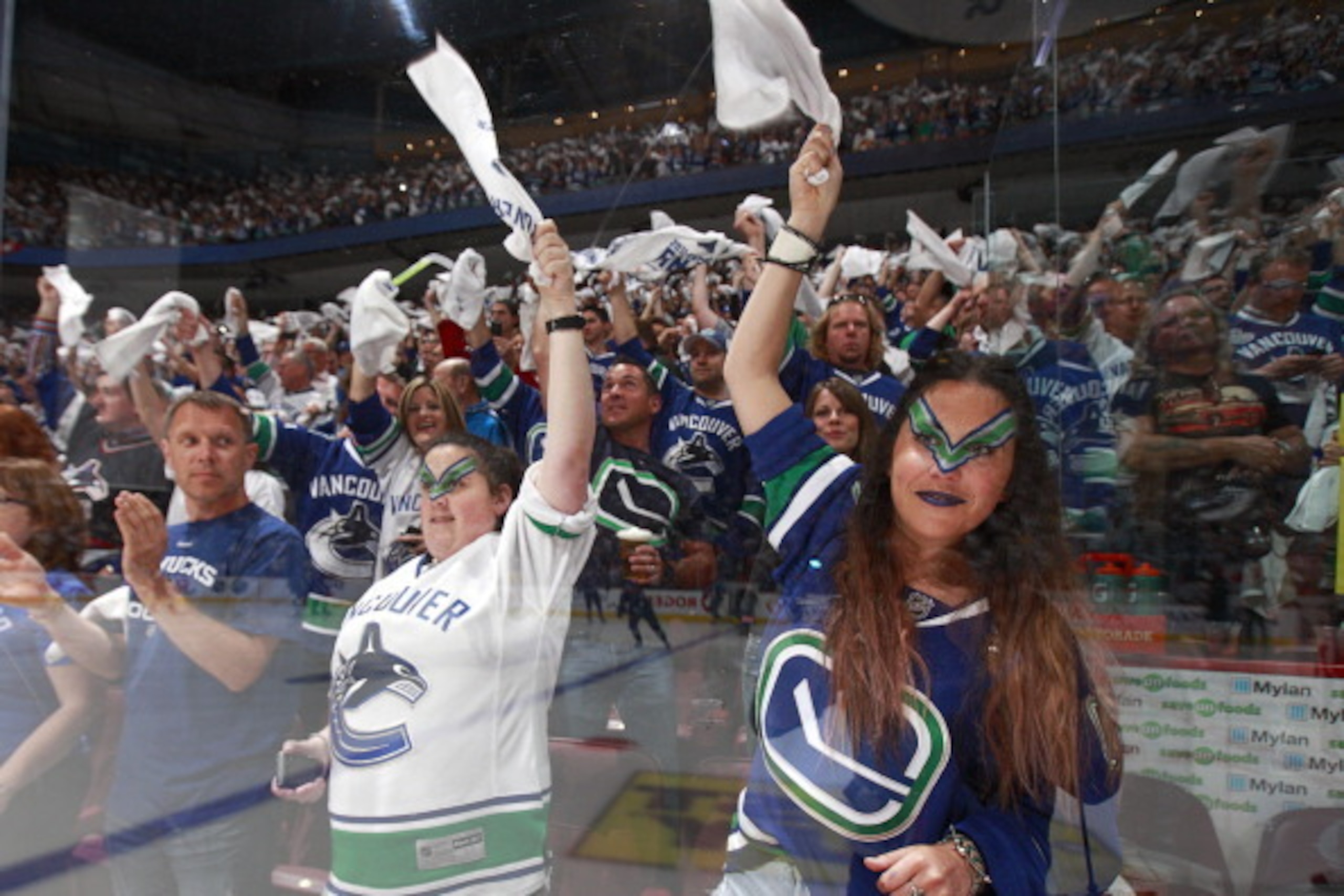 VANCOUVER, CANADA - JUNE 15: Vancouver Canuck fans cheer during Game Seven of 2011 NHL Stanley Cup Final against the Boston Bruins at Rogers Arena on June 15, 2011 in Vancouver, British Columbia, Canada. Boston won 4-0 to win the Stanley Cup. (Photo by J VANCOUVER, CANADA - JUNE 15: Vancouver Canuck fans cheer during Game Seven of 2011 NHL Stanley Cup Final against the Boston Bruins at Rogers Arena on June 15, 2011 in Vancouver, British Columbia, Canada. Boston won 4-0 to win the Stanley Cup. (Photo by J