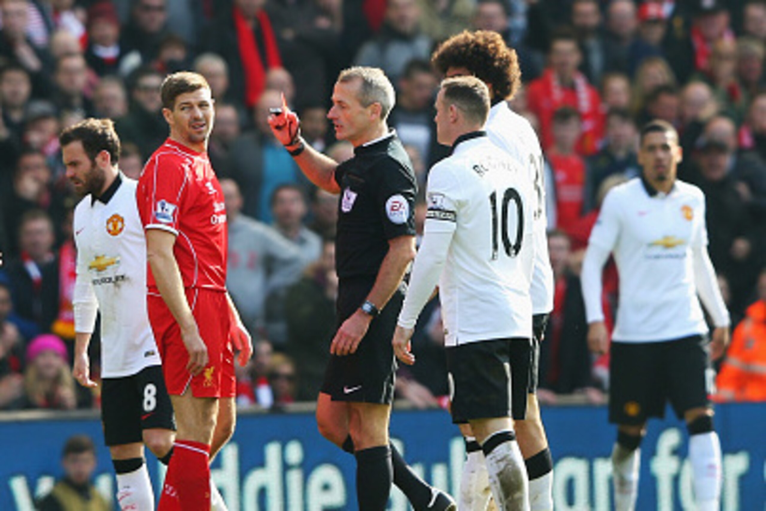 LIVERPOOL, ENGLAND - MARCH 22: Steven Gerrard of Liverpool is shown the red card by referee Martin Atkinson during the Barclays Premier League match between Liverpool and Manchester United at Anfield on March 22, 2015 in Liverpool, England.  (Photo by Ale
