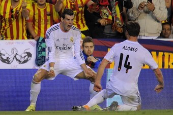 VALENCIA, SPAIN - APRIL 16:  Gareth Bale (L) of Real Madrid celebrates beside Xabi Alonso after scoring Real's 2nd goal during the  Copa del Rey Final between Real Madrid and Barcelona at Estadio Mestalla on April 16, 2014 in Valencia, Spain.  (Photo by D