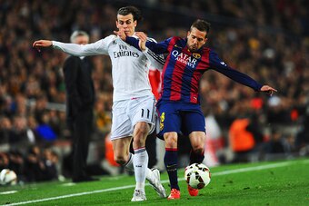 BARCELONA, SPAIN - MARCH 22:  Gareth Bale of Real Madrid CF battles with Jordi Alba of Barcelona during the La Liga match between FC Barcelona and Real Madrid CF at Camp Nou on March 22, 2015 in Barcelona, Spain.  (Photo by David Ramos/Getty Images)