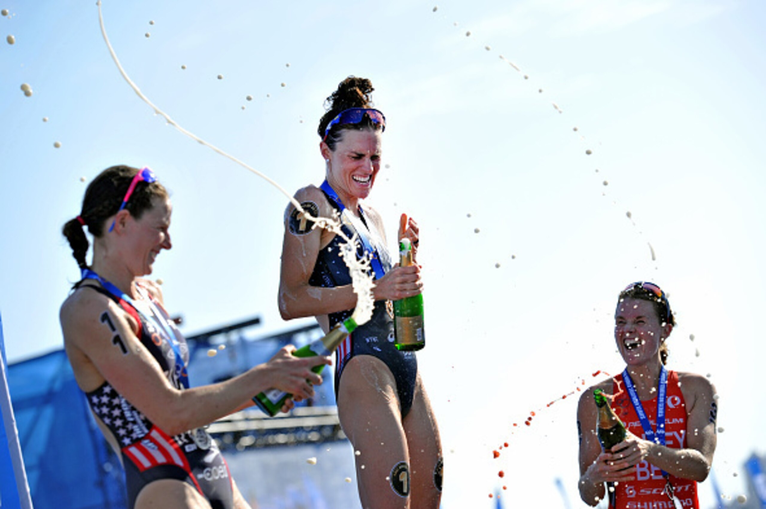 ABU DHABI - MARCH 07: In this photo provided by the International Triathlon Union (ITU), (L-R) 2nd place winner Katie Zaferes of the United States, 1st place winner Gwen Jorgensen (C) of the United States and 3rd place winner Flora Duffy of Bermuda celebr