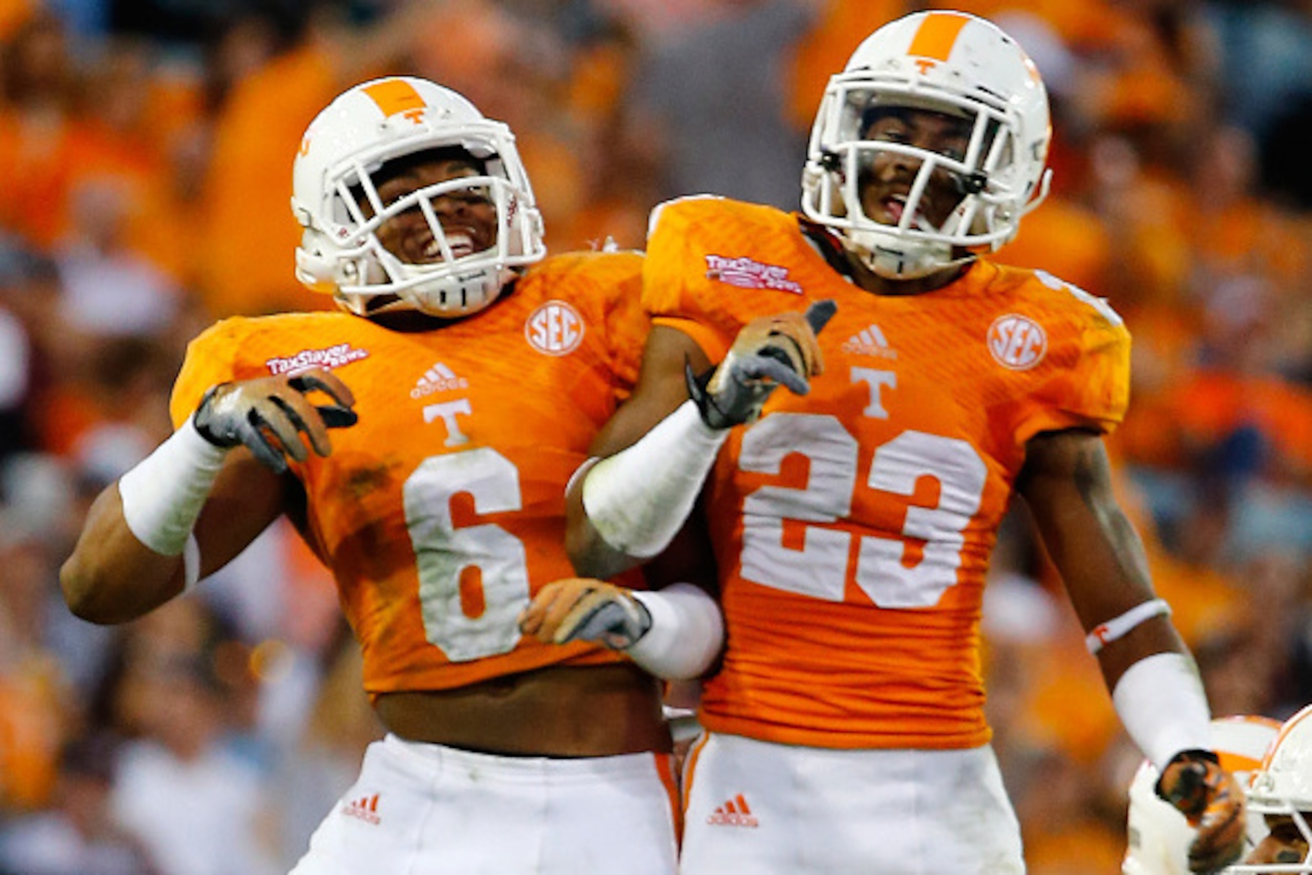 JACKSONVILLE, FL - JANUARY 02:  Todd Kelly Jr. #6 and Cameron Sutton #23 of the Tennessee Volunteers celebrate a defensive play during the TaxSlayer Bowl against the Iowa Hawkeyes at EverBank Field on January 2, 2015 in Jacksonville, Florida.  (Photo by S