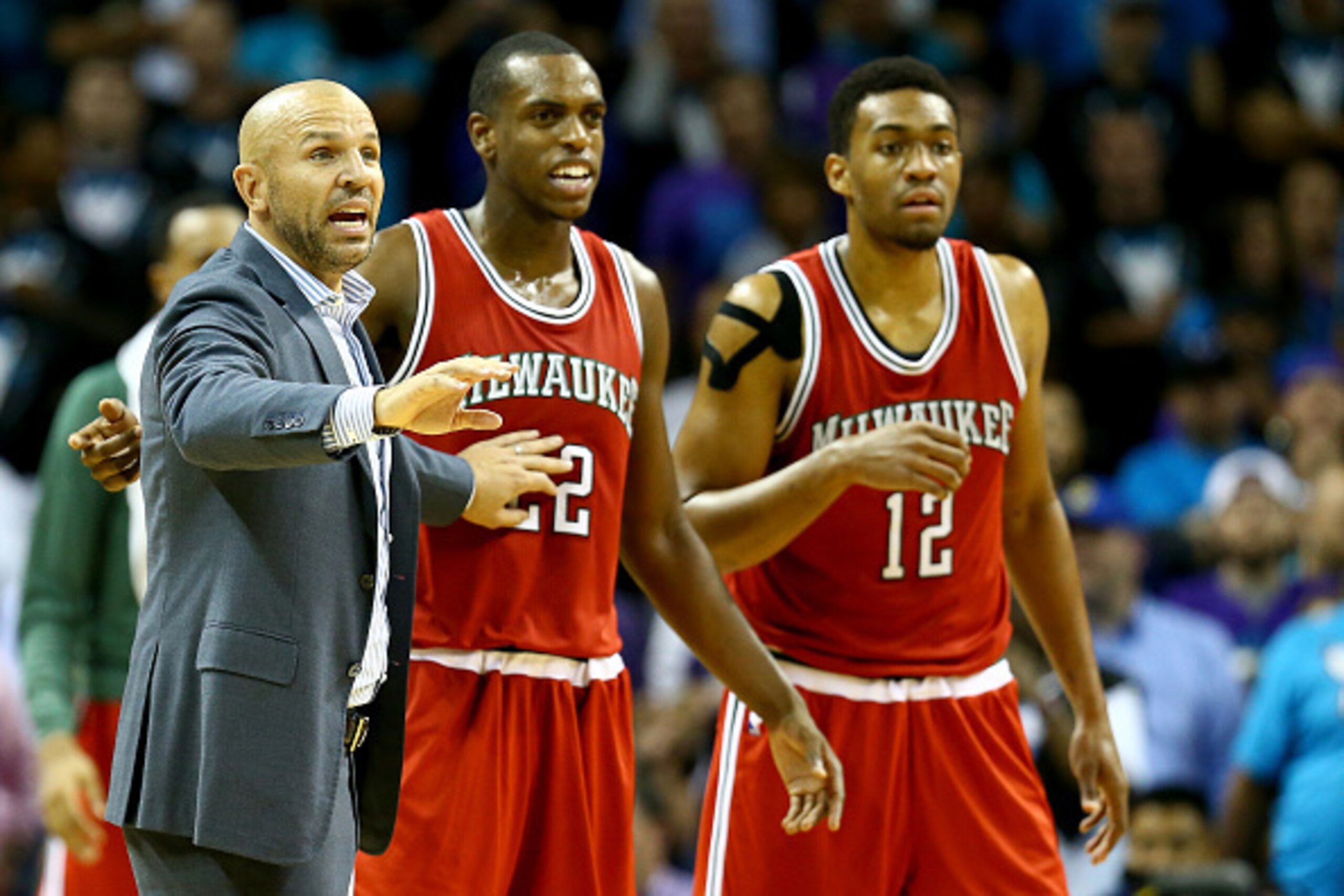 CHARLOTTE, NC - OCTOBER 29:  Head coach Jason Kidd of the Milwaukee Bucks reacts with his players Khris Middleton #22 and Jabari Parker #12 of the Milwaukee Bucks during their game against the Charlotte Hornets at Time Warner Cable Arena on October 29, 20