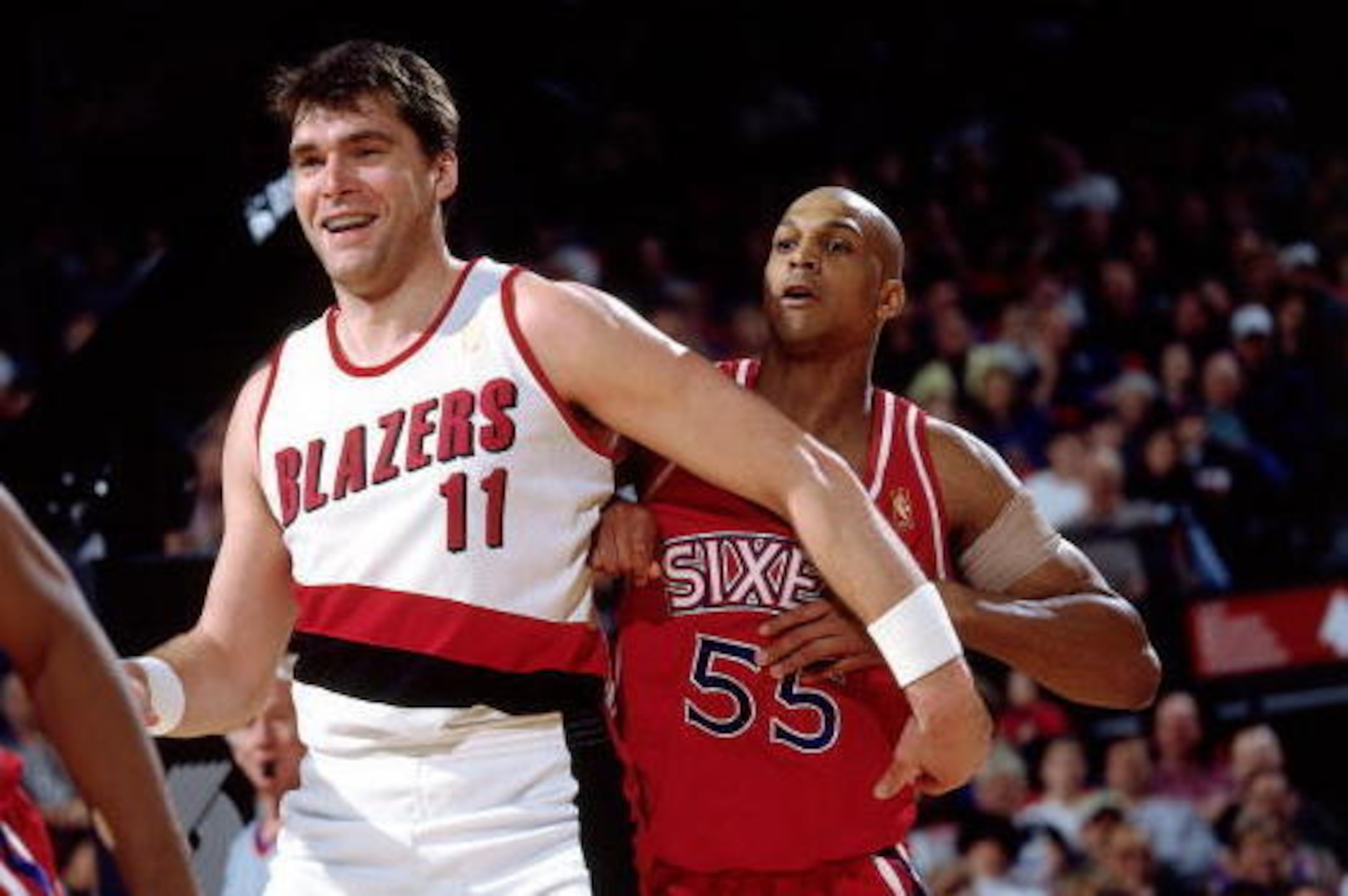 PORTLAND, OR - MARCH 2:  Arvydas Sabonis #11 of the Portland Trail Blazers boxes out for rebound position against the Philadelphia 76ers on March 2, 1997 at the The Rose Garden in Portland, Oregon.  NOTE TO USER:  User expressly acknowledges and agrees th