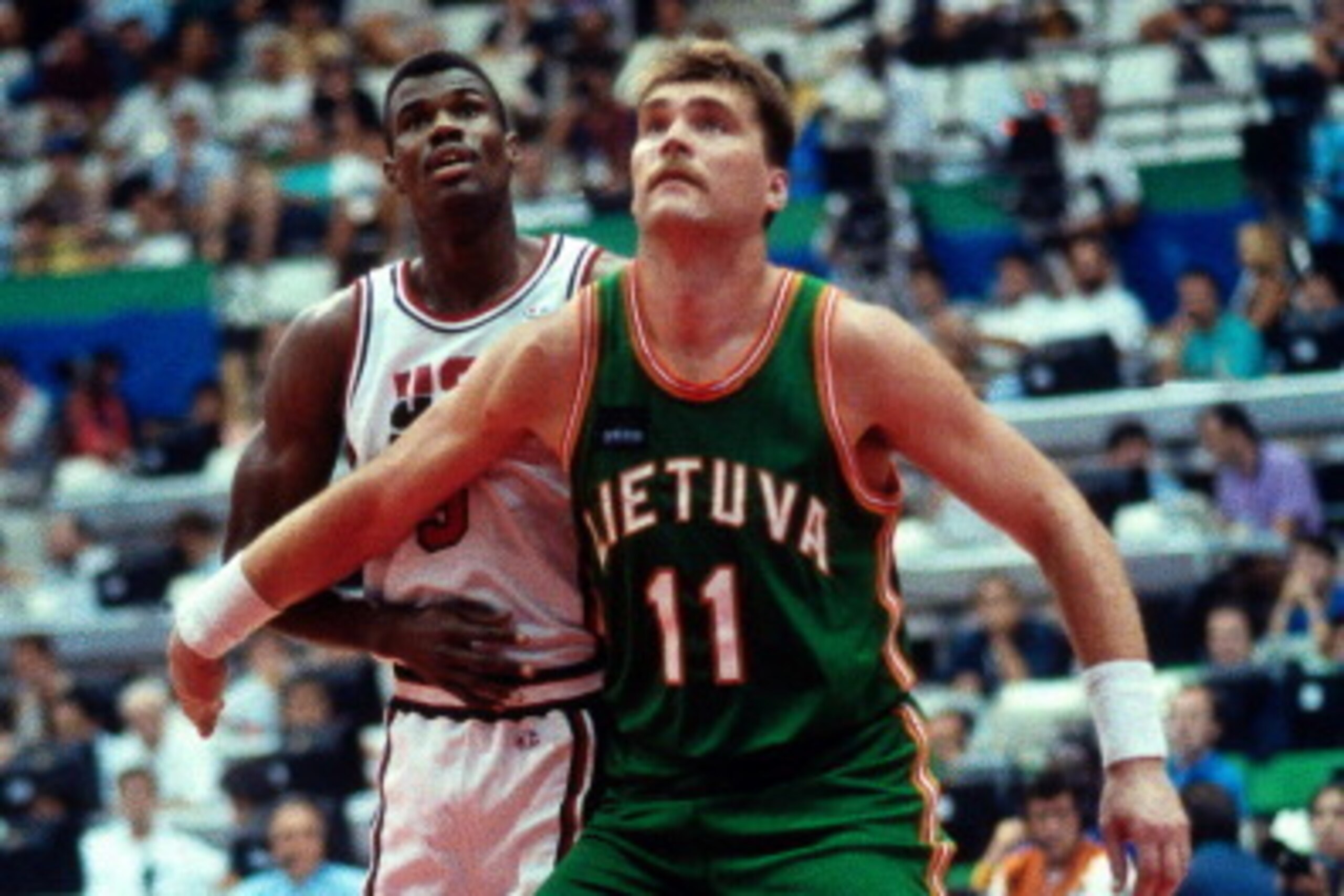 BARCELONA, SPAIN- AUGUST 6: Arvydas Sabonis #11 of Lithuania boxes out against David Robinson #5 of the United States during the 1992 Olympics on August 6, 1992 at the Palau Municipal d'Esports de badalona in Barcelona, Spain. The United States defeated L