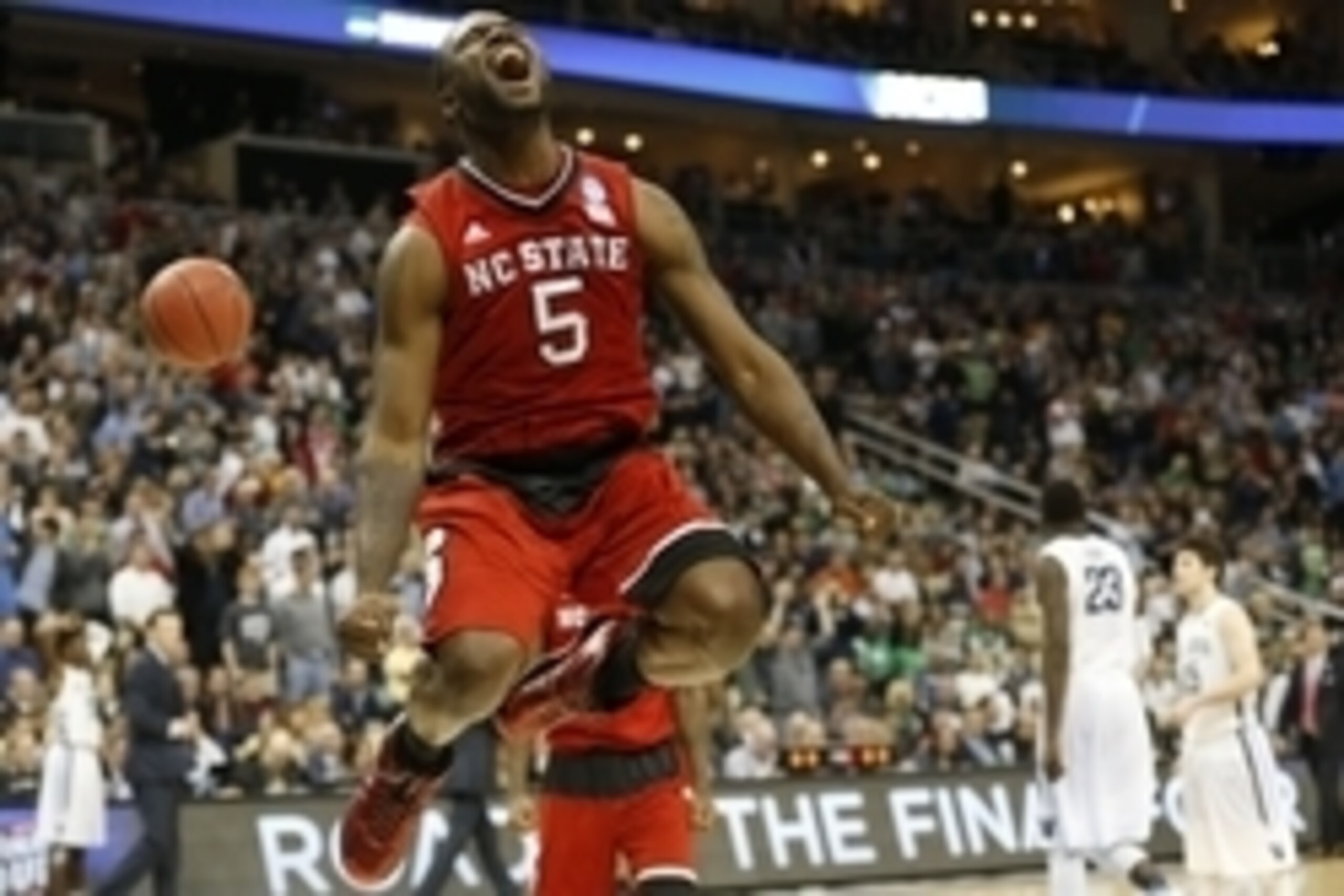 Mar 21, 2015; Pittsburgh, PA, USA; North Carolina State Wolfpack guard Desmond Lee (5) celebrates after defeating the Villanova Wildcats 71-68 in the third round of the 2015 NCAA Tournamentat Consol Energy Center. Mandatory Credit: Geoff Burke-USA TODAY S