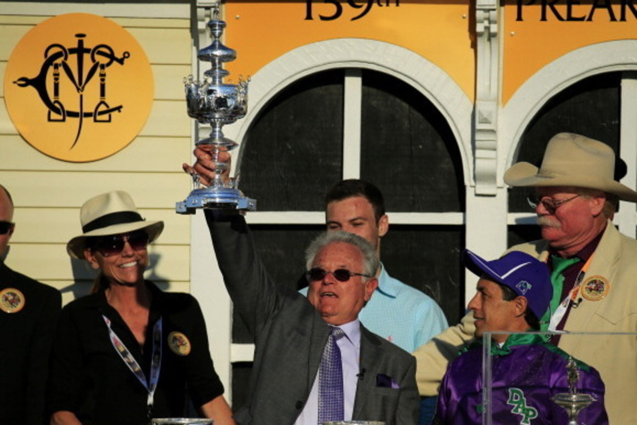 BALTIMORE, MD - MAY 17: Jockey Victor Espinoza celebrates with owner Steve Coburn and trainer Art Sherman after winning the 139th running of the Preakness Stakes atop California Chrome #3 at Pimlico Race Course on May 17, 2014 in Baltimore, Maryland. (P BALTIMORE, MD - MAY 17: Jockey Victor Espinoza celebrates with owner Steve Coburn and trainer Art Sherman after winning the 139th running of the Preakness Stakes atop California Chrome #3 at Pimlico Race Course on May 17, 2014 in Baltimore, Maryland. (P