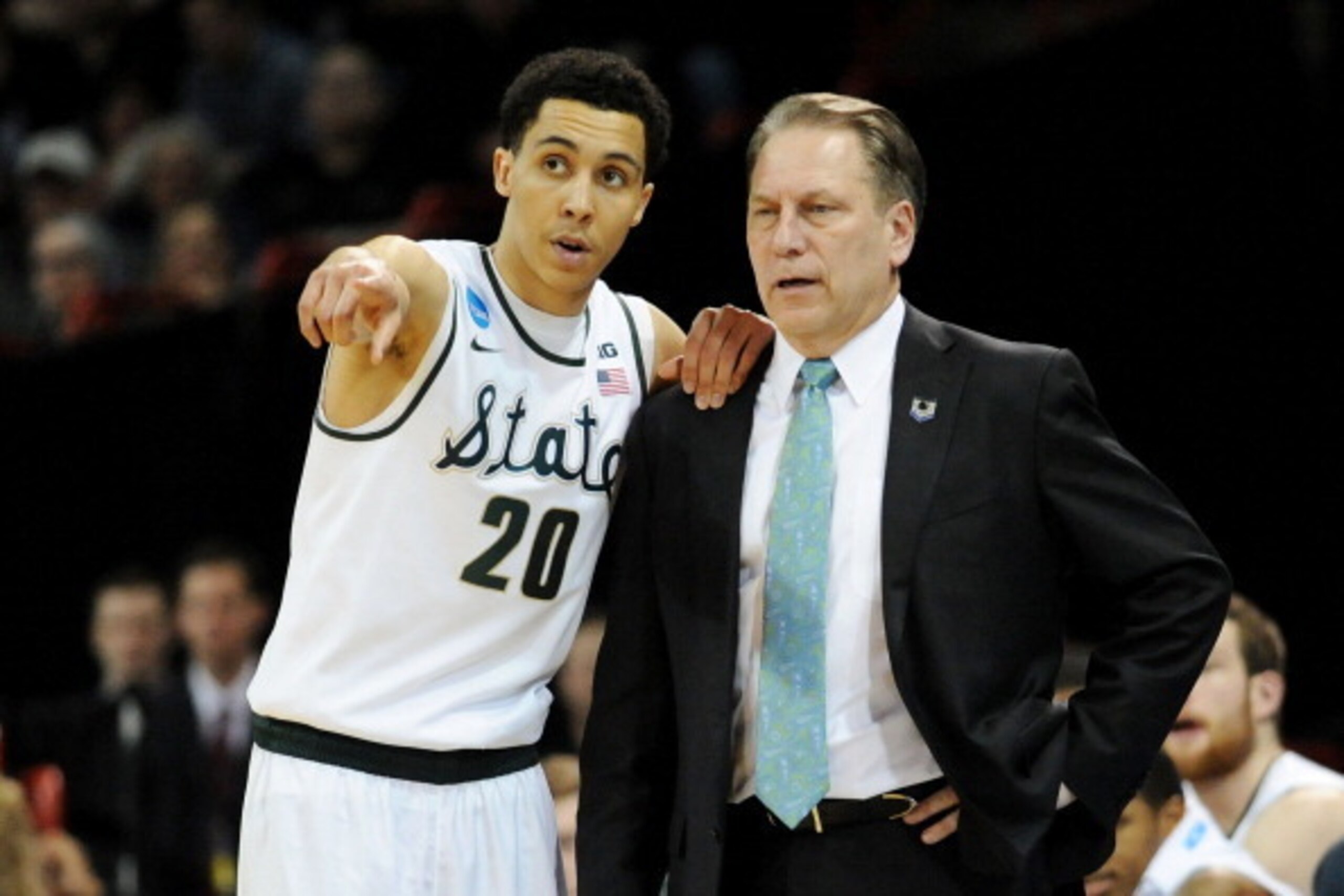 SPOKANE, WA - MARCH 22: Head coach Tom Izzo and Travis Trice #20 of the Michigan State Spartans talk in the second half against the Harvard Crimson during the Third Round of the 2014 NCAA Basketball Tournament at Spokane Veterans Memorial Arena on March SPOKANE, WA - MARCH 22: Head coach Tom Izzo and Travis Trice #20 of the Michigan State Spartans talk in the second half against the Harvard Crimson during the Third Round of the 2014 NCAA Basketball Tournament at Spokane Veterans Memorial Arena on March