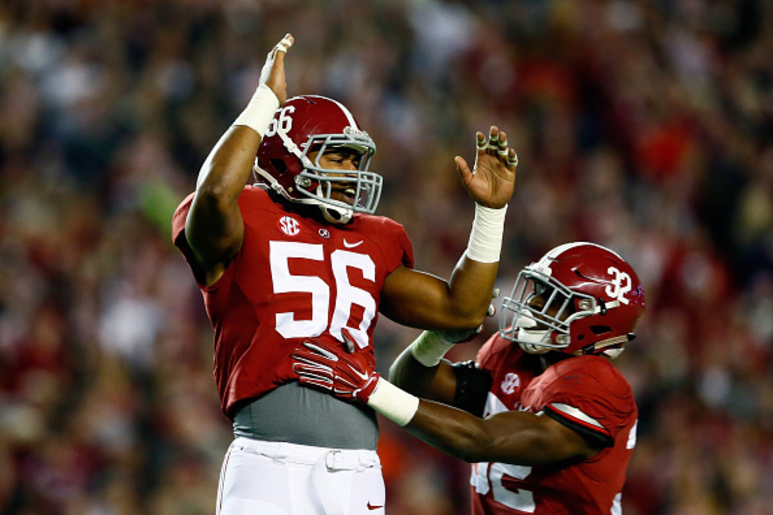 TUSCALOOSA, AL - NOVEMBER 29:  Tim Williams #56 of the Alabama Crimson Tide celebrates sacking Nick Marshall #14 of the Auburn Tigers in the fourth quarter during the Iron Bowl at Bryant-Denny Stadium on November 29, 2014 in Tuscaloosa, Alabama.  (Photo b