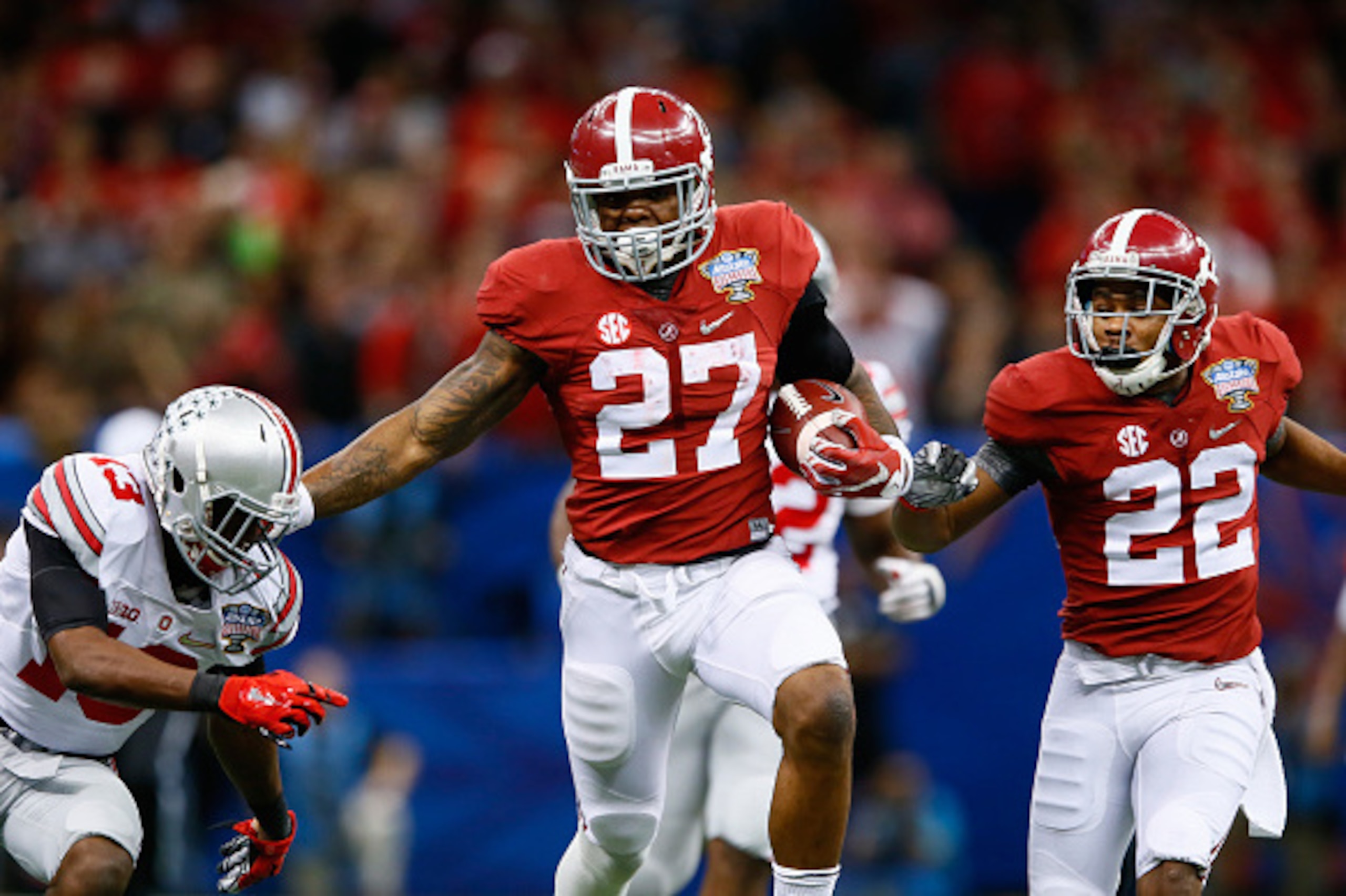 NEW ORLEANS, LA - JANUARY 01:  Derrick Henry #27 of the Alabama Crimson Tide runs the ball against the Ohio State Buckeyes during the All State Sugar Bowl at the Mercedes-Benz Superdome on January 1, 2015 in New Orleans, Louisiana.  (Photo by Kevin C. Cox