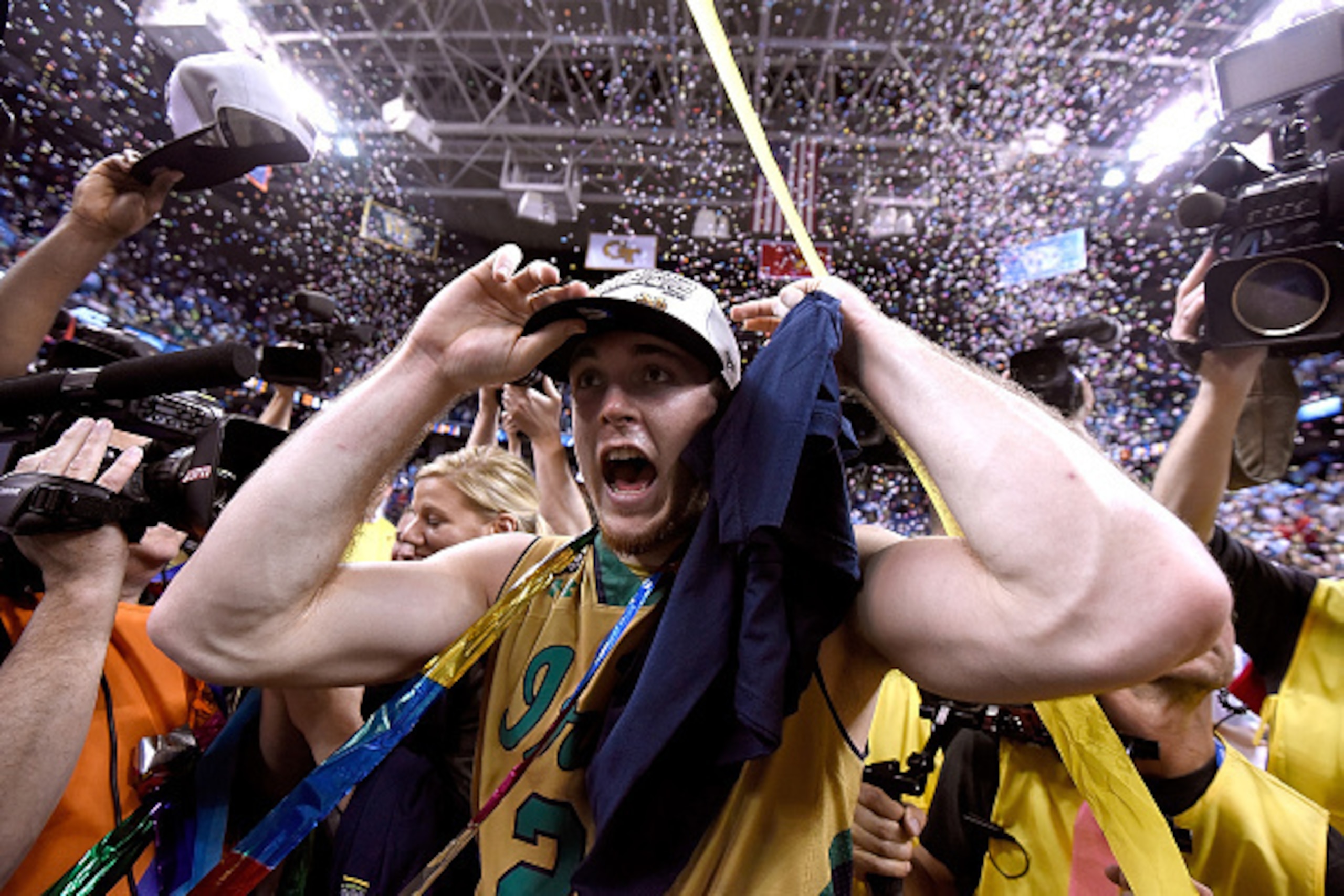 GREENSBORO, NC - MARCH 14:  Pat Connaughton #24 and the Notre Dame Fighting Irish celebrate after defeating the North Carolina Tar Heels during the championship game of the ACC Basketball Tournament at Greensboro Coliseum on March 14, 2015 in Greensboro, 
