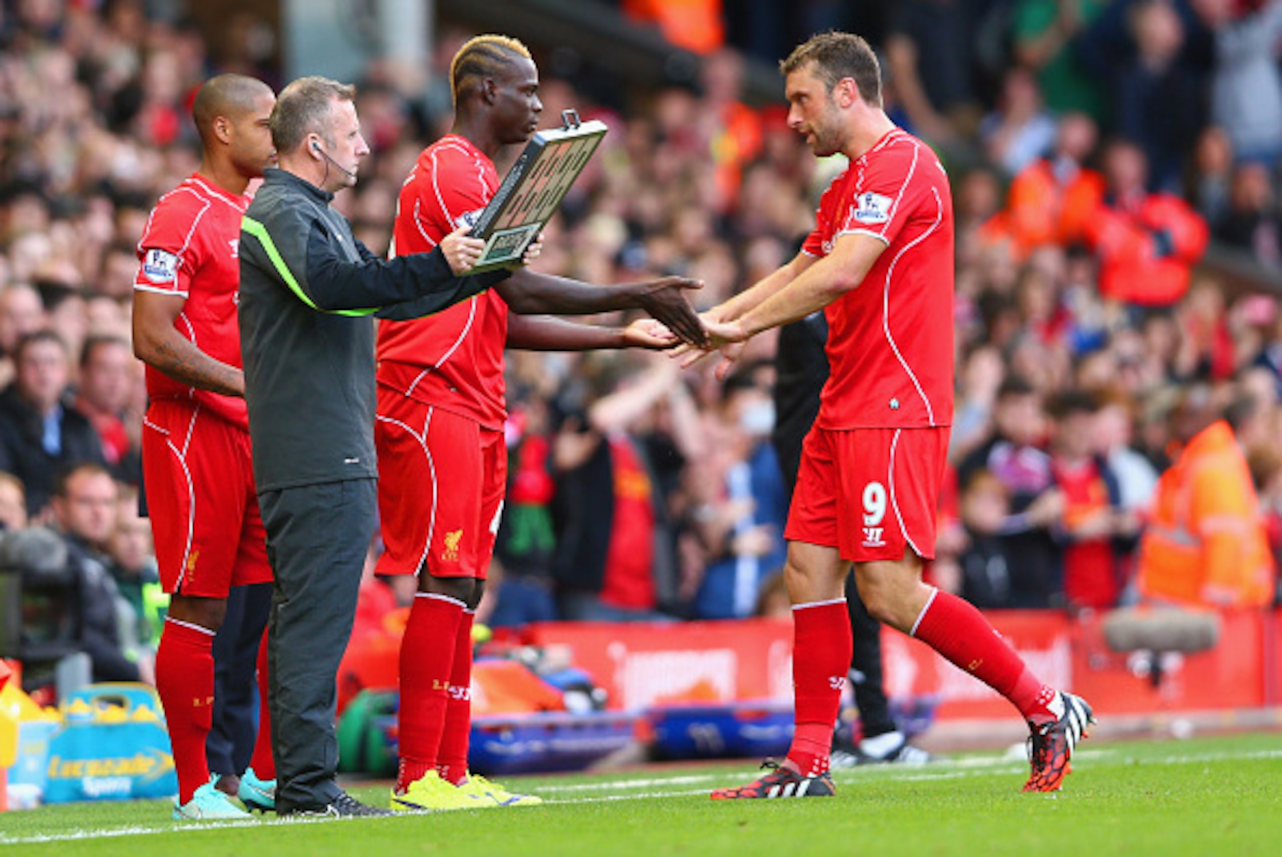 LIVERPOOL, ENGLAND - OCTOBER 04: Mario Balotelli of Liverpool replaces Rickie Lambert of Liverpool during the Barclays Premier League match between Liverpool and West Bromwich Albion at Anfield on October 4, 2014 in Liverpool, England. (Photo by Clive B LIVERPOOL, ENGLAND - OCTOBER 04: Mario Balotelli of Liverpool replaces Rickie Lambert of Liverpool during the Barclays Premier League match between Liverpool and West Bromwich Albion at Anfield on October 4, 2014 in Liverpool, England. (Photo by Clive B