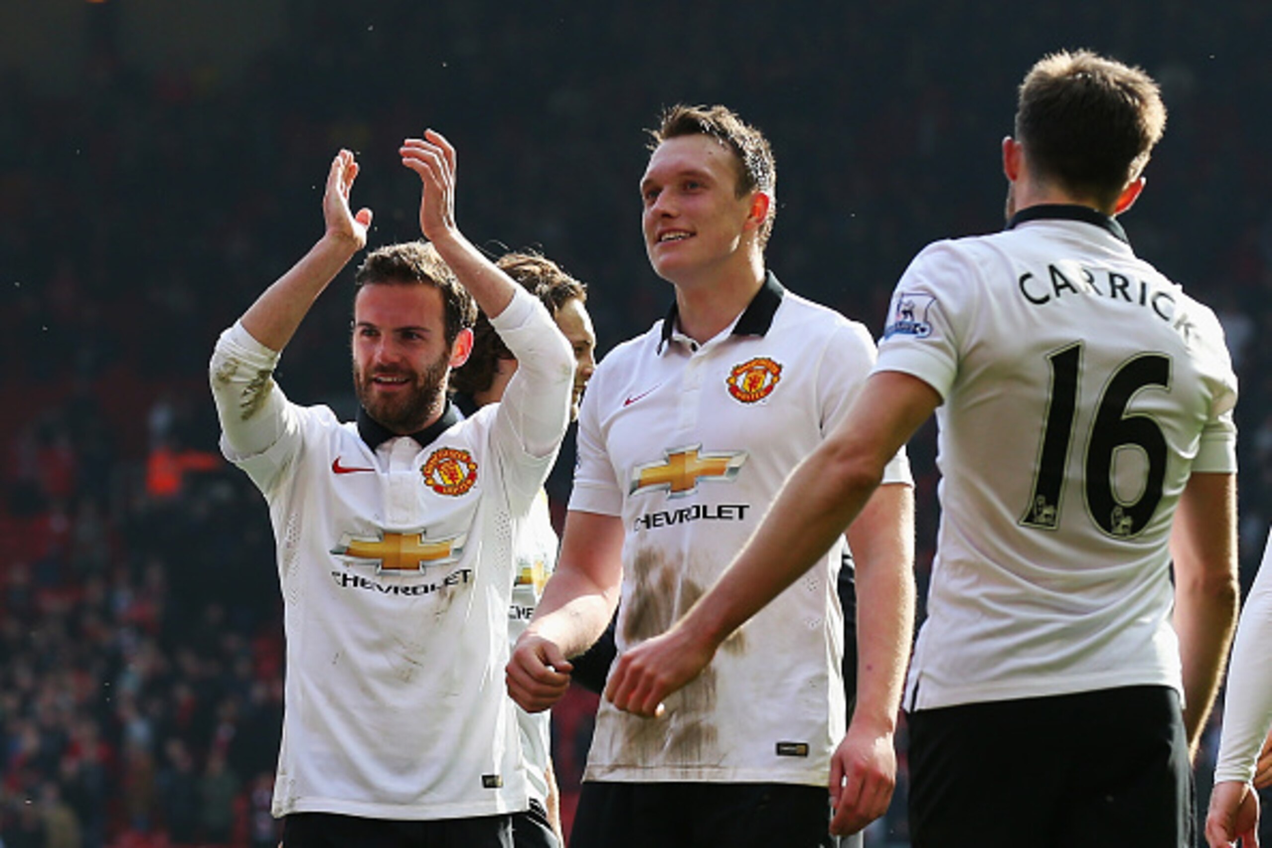 LIVERPOOL, ENGLAND - MARCH 22:  Juan Mata (L) and Phil Jones of Manchester United celebrate victory after the Barclays Premier League match between Liverpool and Manchester United at Anfield on March 22, 2015 in Liverpool, England.  (Photo by Alex Livesey
