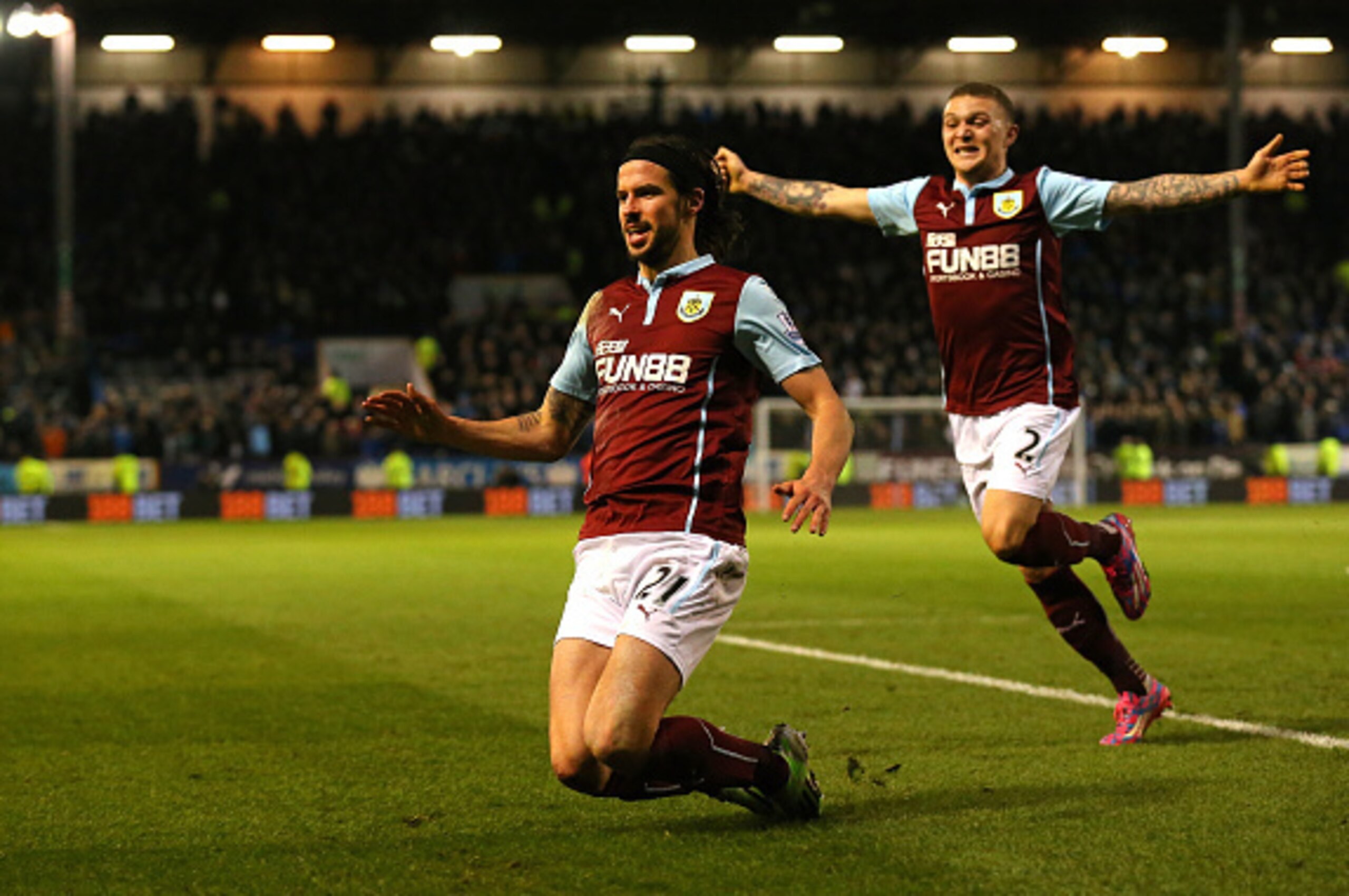 BURNLEY, ENGLAND - MARCH 14:  George Boyd of Burnley (L) celebrates scoring the opening goal with Kieran Trippier of Burnley during the Barclays Premier League match between Burnley and Manchester City at Turf Moor on March 14, 2015 in Burnley, England.  
