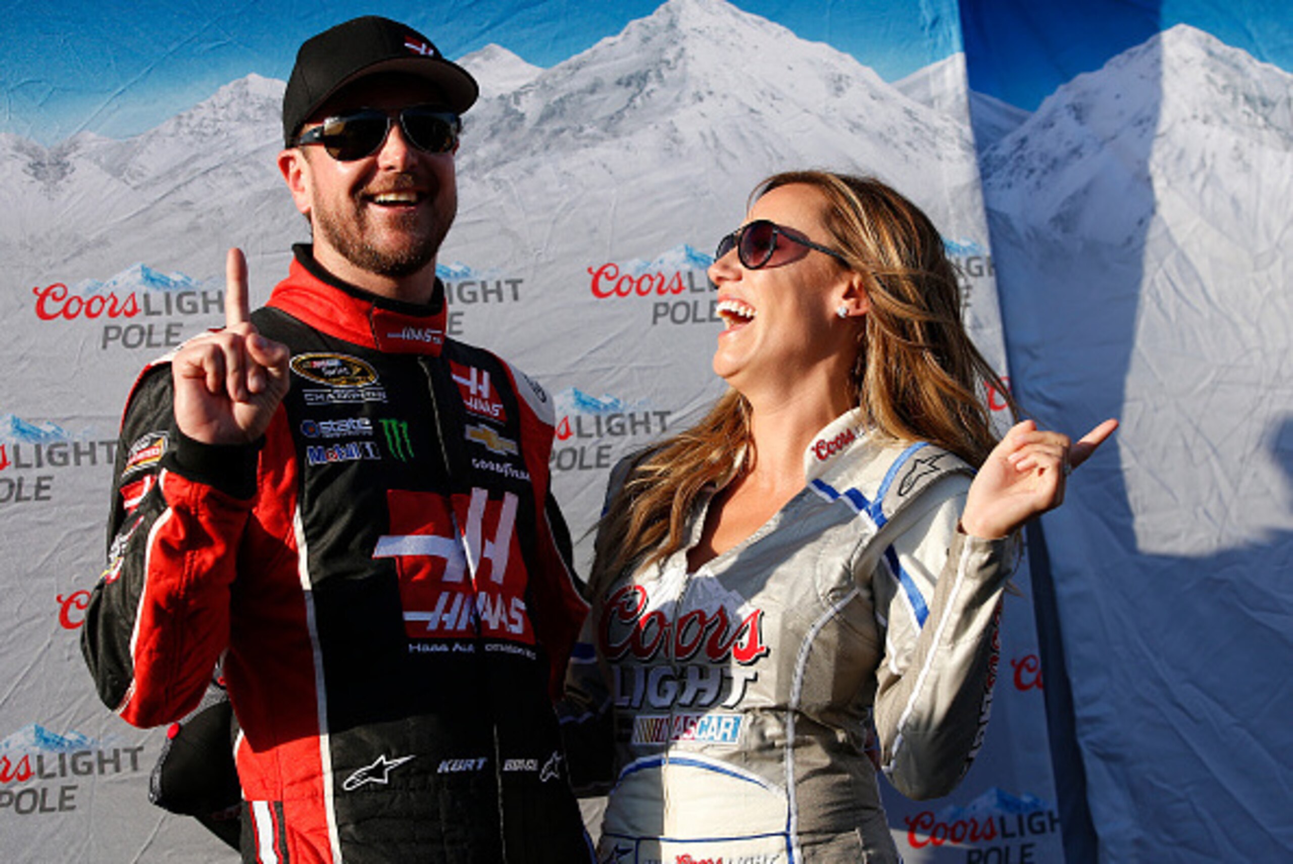 FONTANA, CA - MARCH 20:  Kurt Busch, driver of the #41 Haas Automation Chevrolet, poses for a photo with Miss Coors Light Rachel Rupert after winning the pole during qualifying for the NASCAR Sprint Cup Series Auto Club 400 at Auto Club Speedway on March 