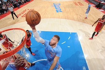 LOS ANGELES, CA - MARCH 15: Blake Griffin #32 of the Los Angeles Clippers goes for the layup against the Houston Rockets during the game on March 15, 2015 at STAPLES Center in Los Angeles, California. NOTE TO USER: User expressly acknowledges and agrees t