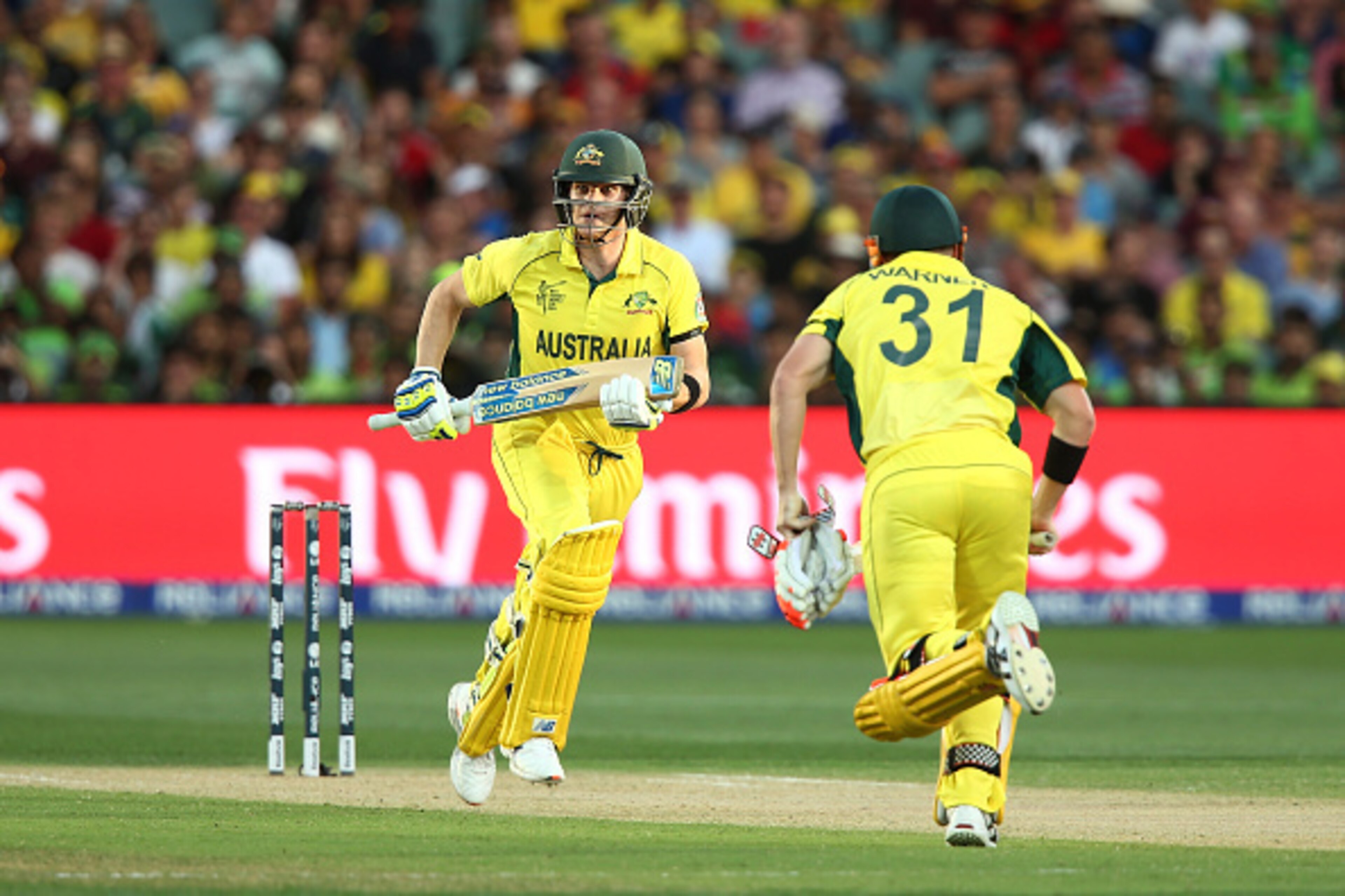 ADELAIDE, AUSTRALIA - MARCH 20: Steve Smith and David Warner of Australia run between the wickets during the 2015 ICC Cricket World Cup match between Australian and Pakistan at Adelaide Oval on March 20, 2015 in Adelaide, Australia.  (Photo by Morne de Kl
