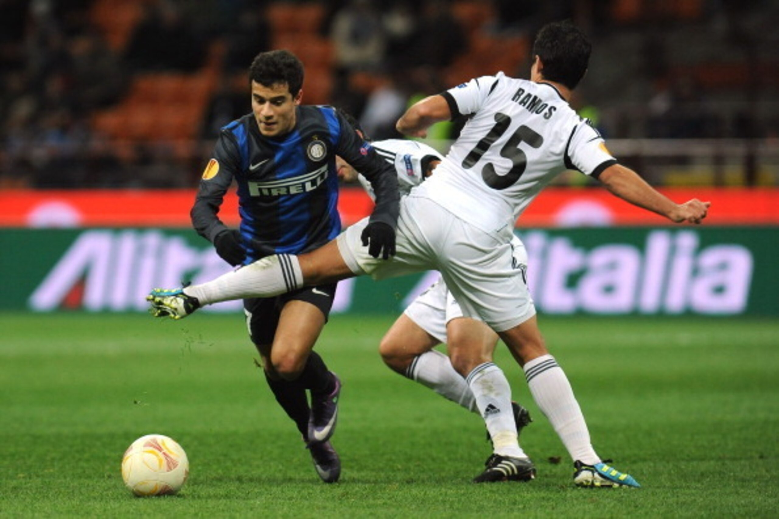 MILAN, ITALY - DECEMBER 06:  Coutinho (L) of FC Internazionale Milano is challenged by Eric Ramos of Neftci PFK during the UEFA Europa League group H match between FC Internazionale Milano and  Neftci PFK on December 6, 2012 in Milan, Italy.  (Photo by Va