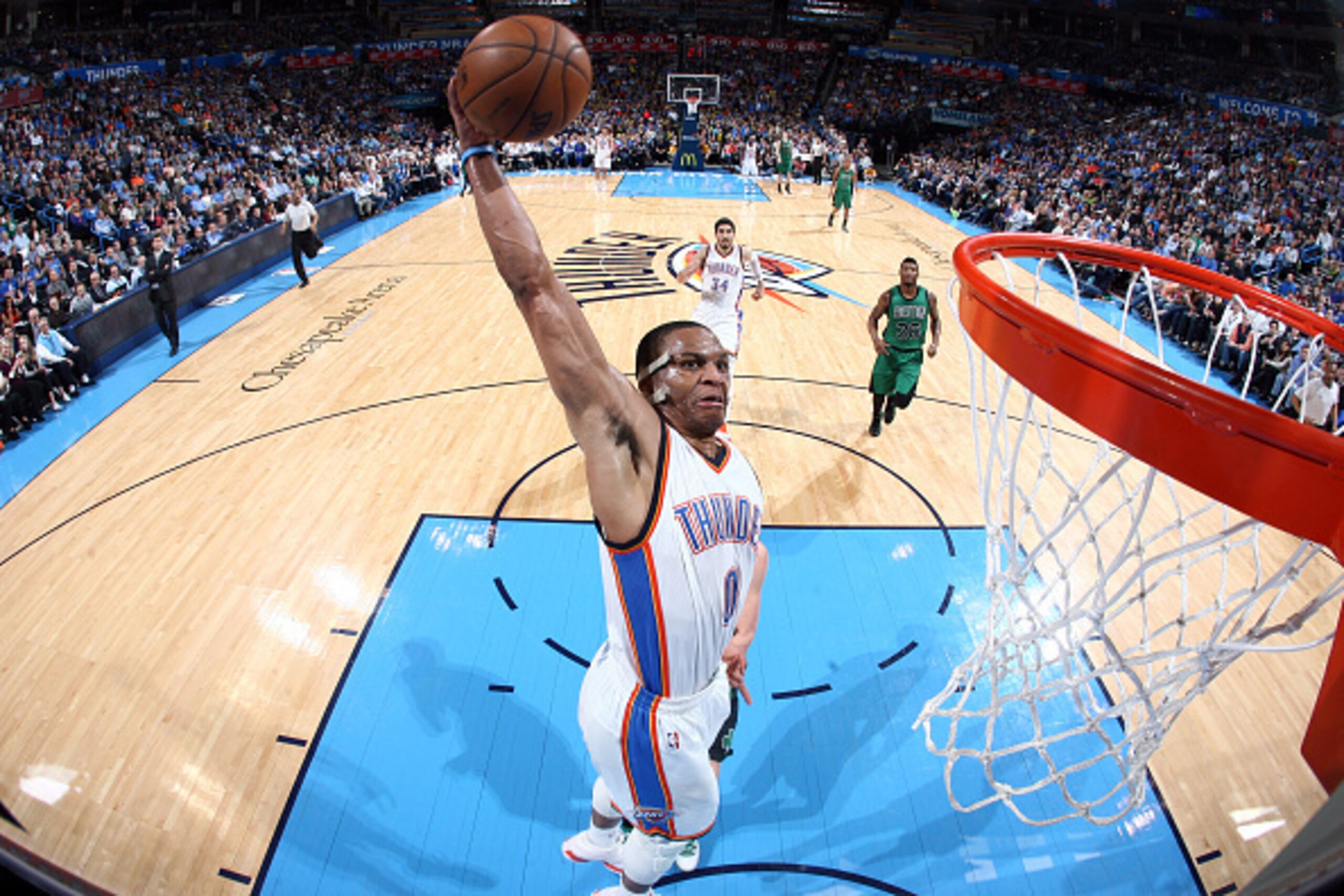 OKLAHOMA CITY, OK - MARCH 18:  Russell Westbrook #0 of the Oklahoma City Thunder goes to the basket against the Boston Celtics on March 18, 2015 at the Chesapeake Energy Arena in Oklahoma City, Oklahoma. NOTE TO USER: User expressly acknowledges and agree