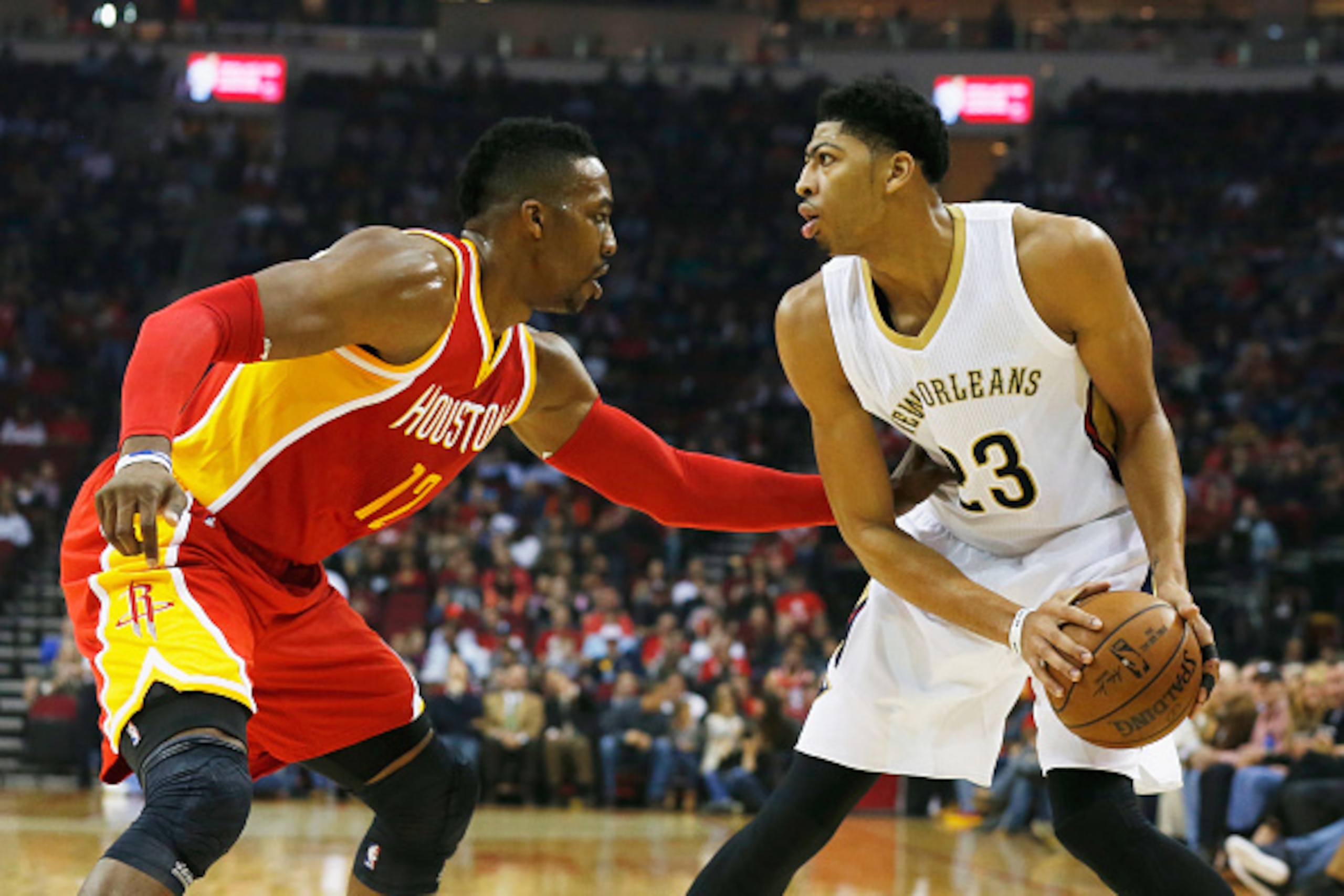 HOUSTON, TX - DECEMBER 18:  HOUSTON, TX - DECEMBER18:  Dwight Howard #12 of the Houston Rockets defends against Anthony Davis #23 of the New Orleans Pelicans during their game at the Toyota Center on December18, 2014 in Houston, Texas.  NOTE TO USER: User