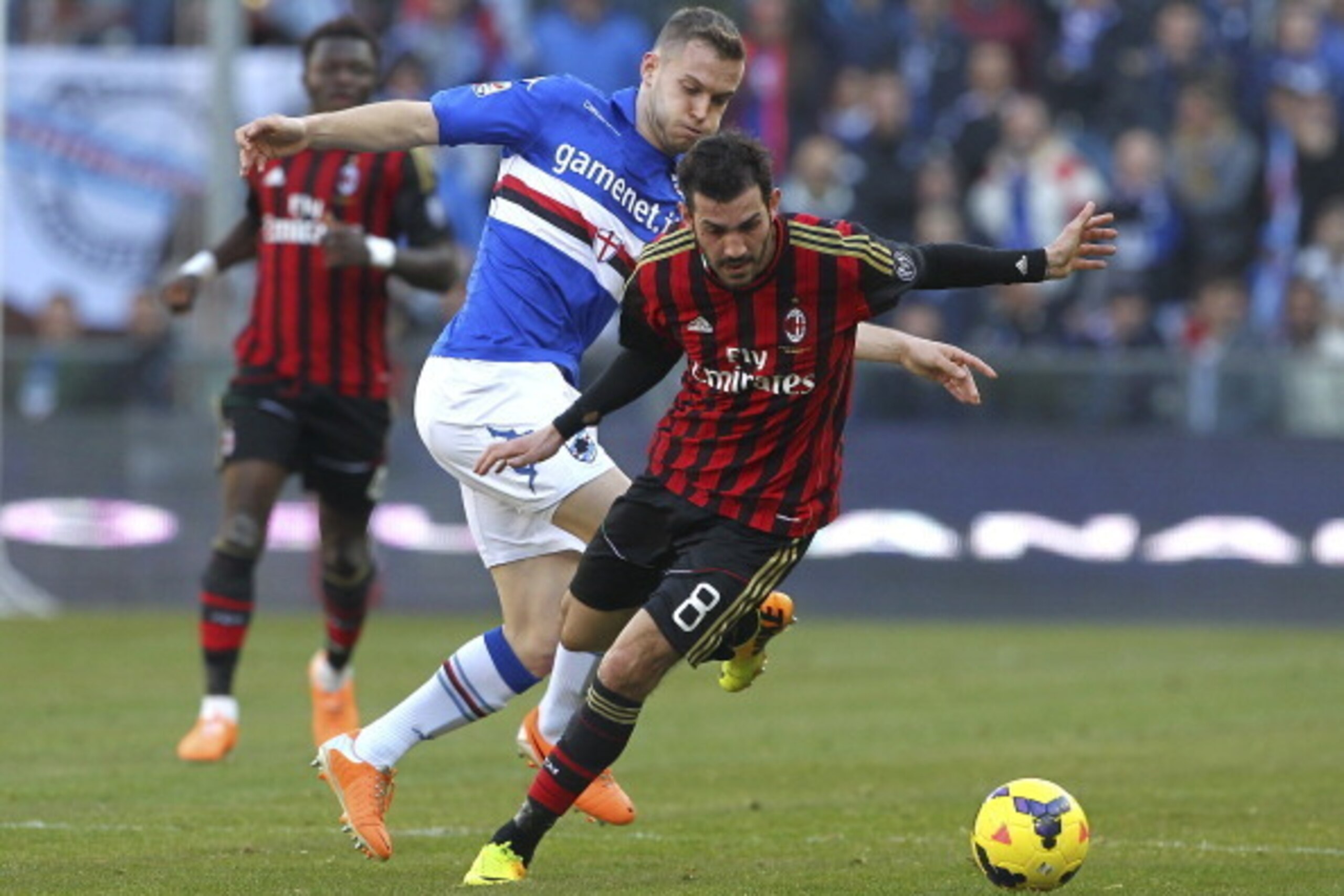 GENOA, ITALY - FEBRUARY 23:  Riccardo Saponara (R) of AC Milan competes for the ball with Michele Fornasier (L) of UC Sampdoria during the Serie A match between UC Sampdoria and AC Milan at Stadio Luigi Ferraris on February 23, 2014 in Genoa, Italy.  (Pho