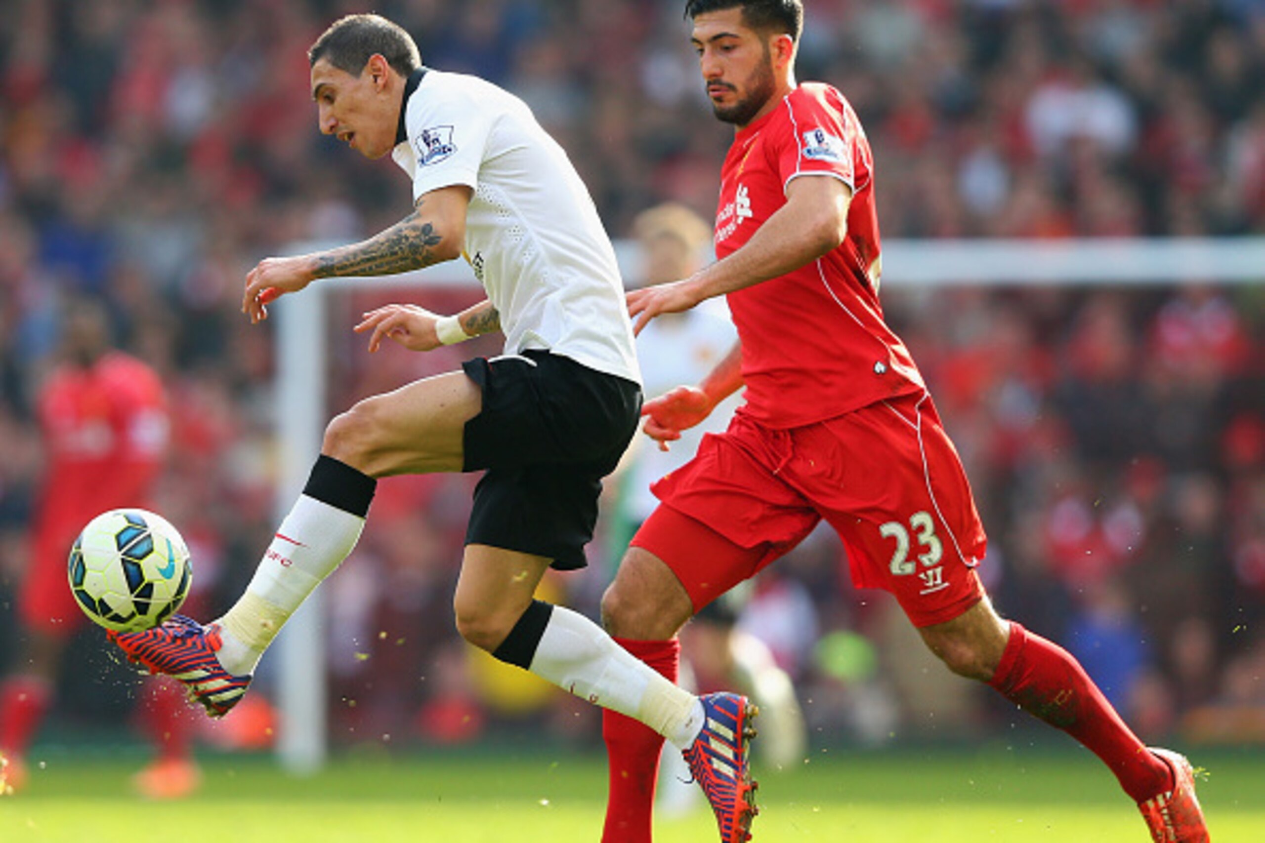 LIVERPOOL, ENGLAND - MARCH 22: Angel Di Maria of Manchester United challenges for the ball with Emre Can of Liverpool during the Barclays Premier League match between Liverpool and Manchester United at Anfield on March 22, 2015 in Liverpool, England. (P LIVERPOOL, ENGLAND - MARCH 22: Angel Di Maria of Manchester United challenges for the ball with Emre Can of Liverpool during the Barclays Premier League match between Liverpool and Manchester United at Anfield on March 22, 2015 in Liverpool, England. (P
