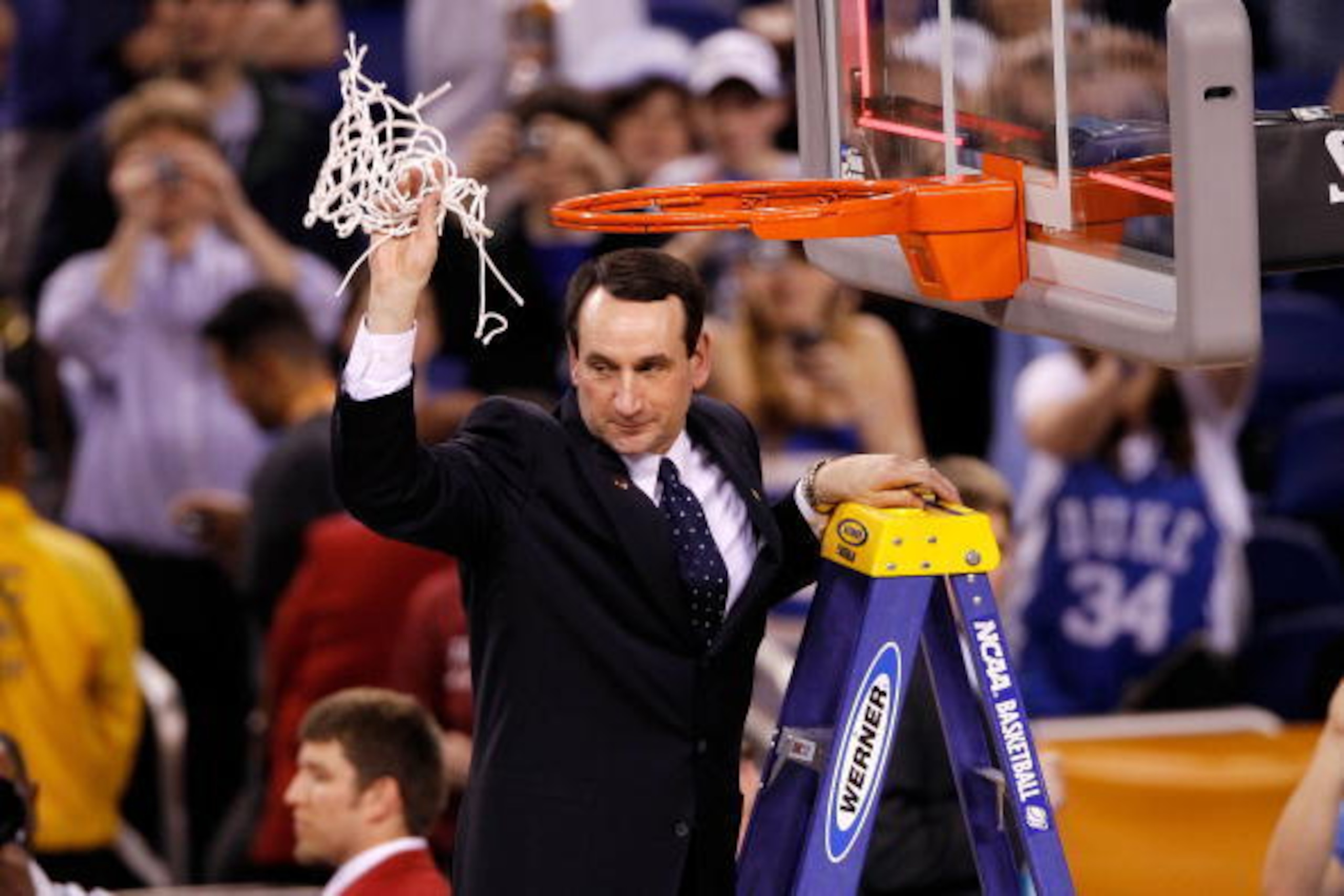 INDIANAPOLIS - APRIL 05:  Head coach Mike Krzyzewski of the Duke Blue Devils celebrates after he cut down a piece of the net following their 61-59 win against the Butler Bulldogs during the 2010 NCAA Division I Men's Basketball National Championship game 