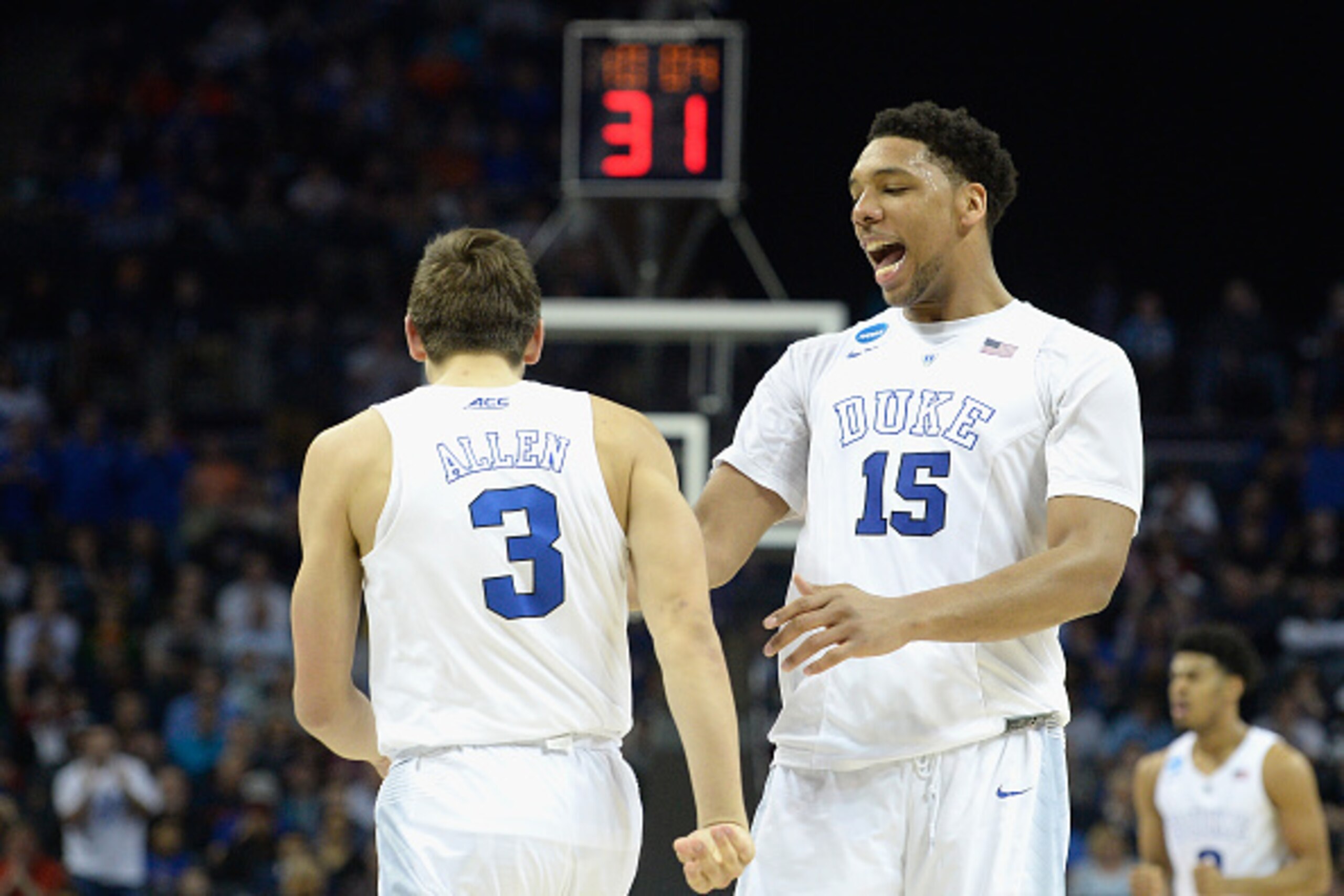 CHARLOTTE, NC - MARCH 22:  Teammates Grayson Allen #3 and Jahlil Okafor #15 of the Duke Blue Devils react against the San Diego State Aztecs during the third round of the 2015 NCAA Men's Basketball Tournament at Time Warner Cable Arena on March 22, 2015 i