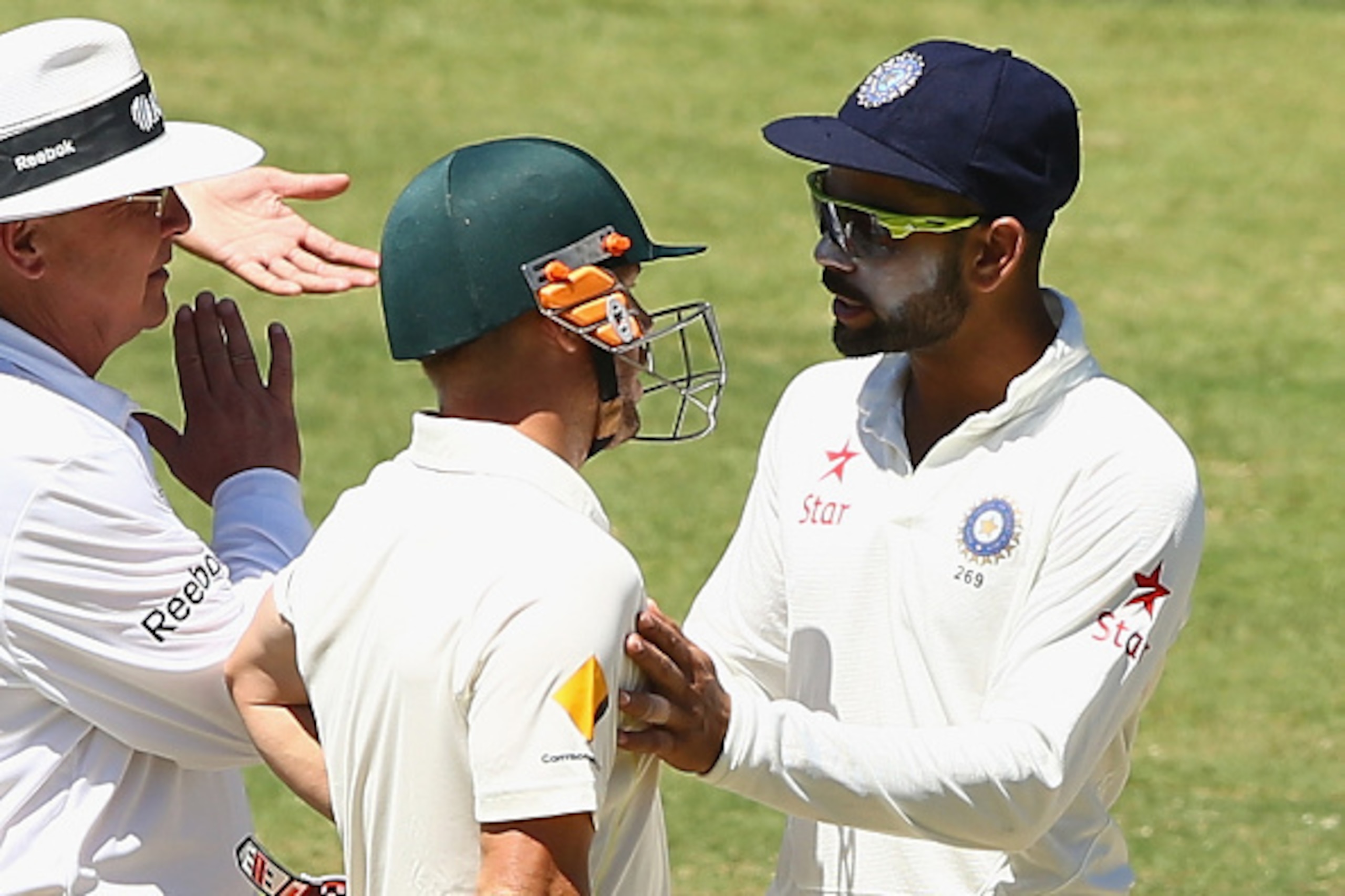ADELAIDE, AUSTRALIA - DECEMBER 12:  Virat Kohli of India and David Warner of Australia confront eachother during day four of the First Test match between Australia and India at Adelaide Oval on December 12, 2014 in Adelaide, Australia.  (Photo by Robert C