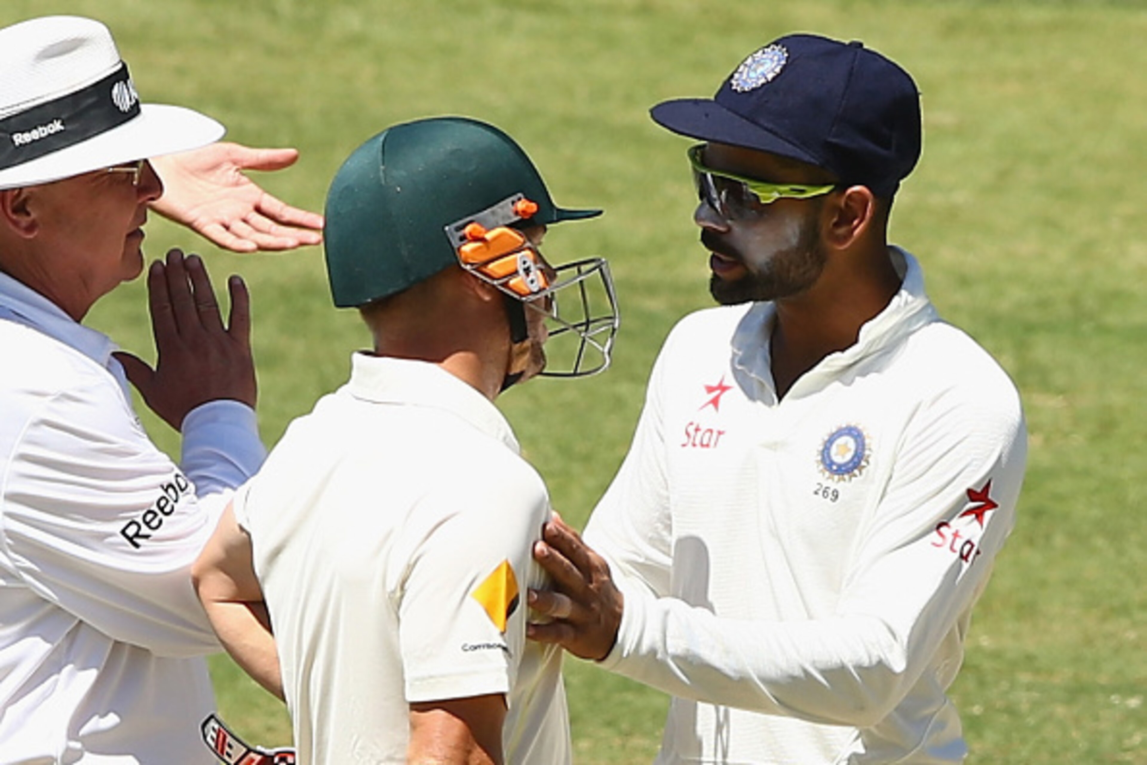 ADELAIDE, AUSTRALIA - DECEMBER 12:  Virat Kohli of India and David Warner of Australia confront eachother during day four of the First Test match between Australia and India at Adelaide Oval on December 12, 2014 in Adelaide, Australia.  (Photo by Robert C