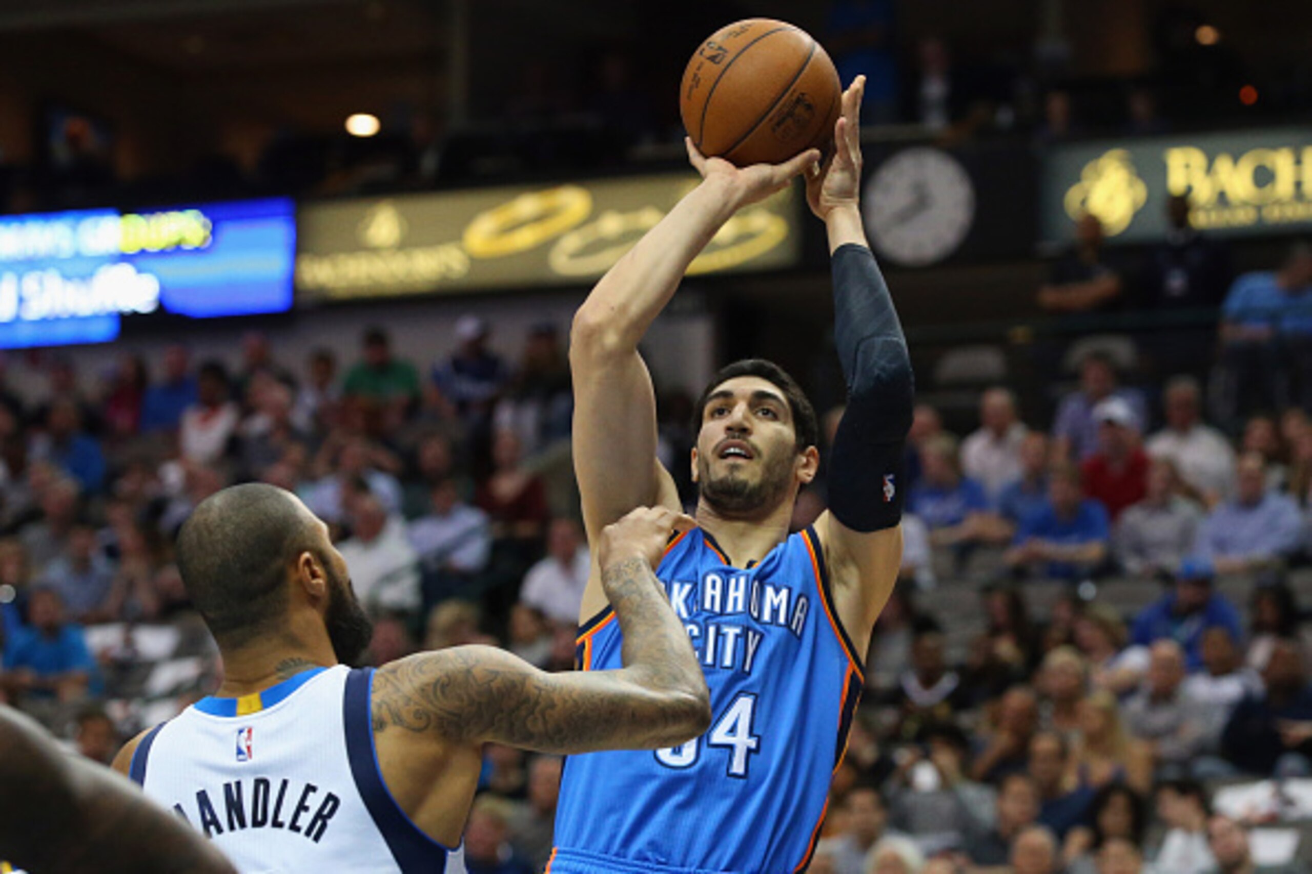 DALLAS, TX - MARCH 16:  Enes Kanter #34 of the Oklahoma City Thunder takes a shot against Tyson Chandler #6 of the Dallas Mavericks at American Airlines Center on March 16, 2015 in Dallas, Texas.  NOTE TO USER: User expressly acknowledges and agrees that,