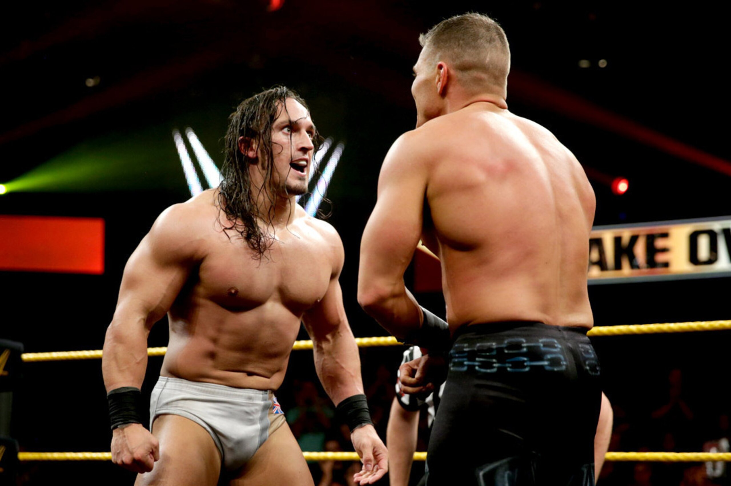 Adrian Neville stares down Tyson Kidd.