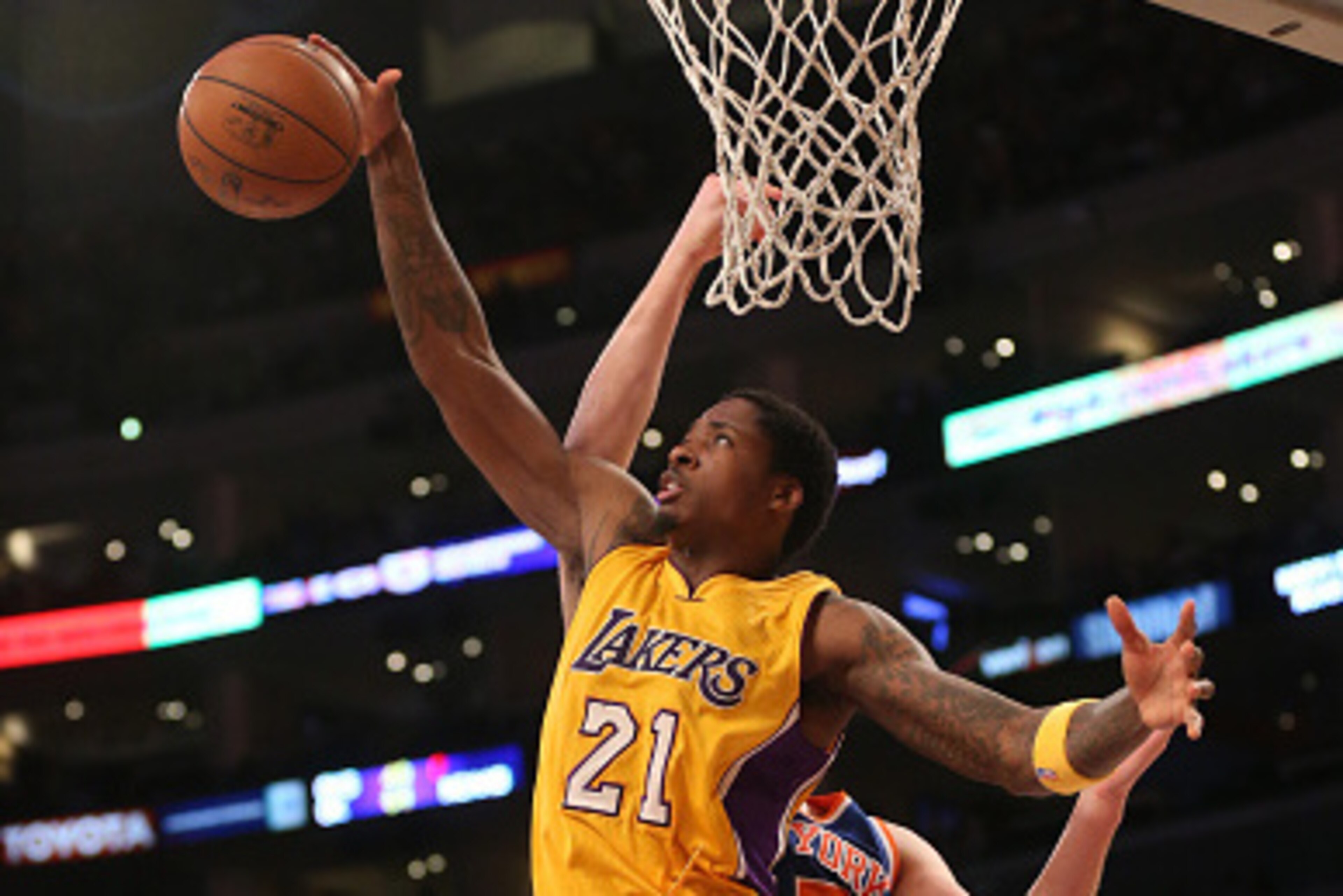 LOS ANGELES, CA - MARCH 12:  Ed Davis #21 of the Los Angeles Lakers grabs a rebound against the New York Knicks at Staples Center on March 12, 2015 in Los Angeles, California.  The Knicks won 101-94.  NOTE TO USER: User expressly acknowledges and agrees t